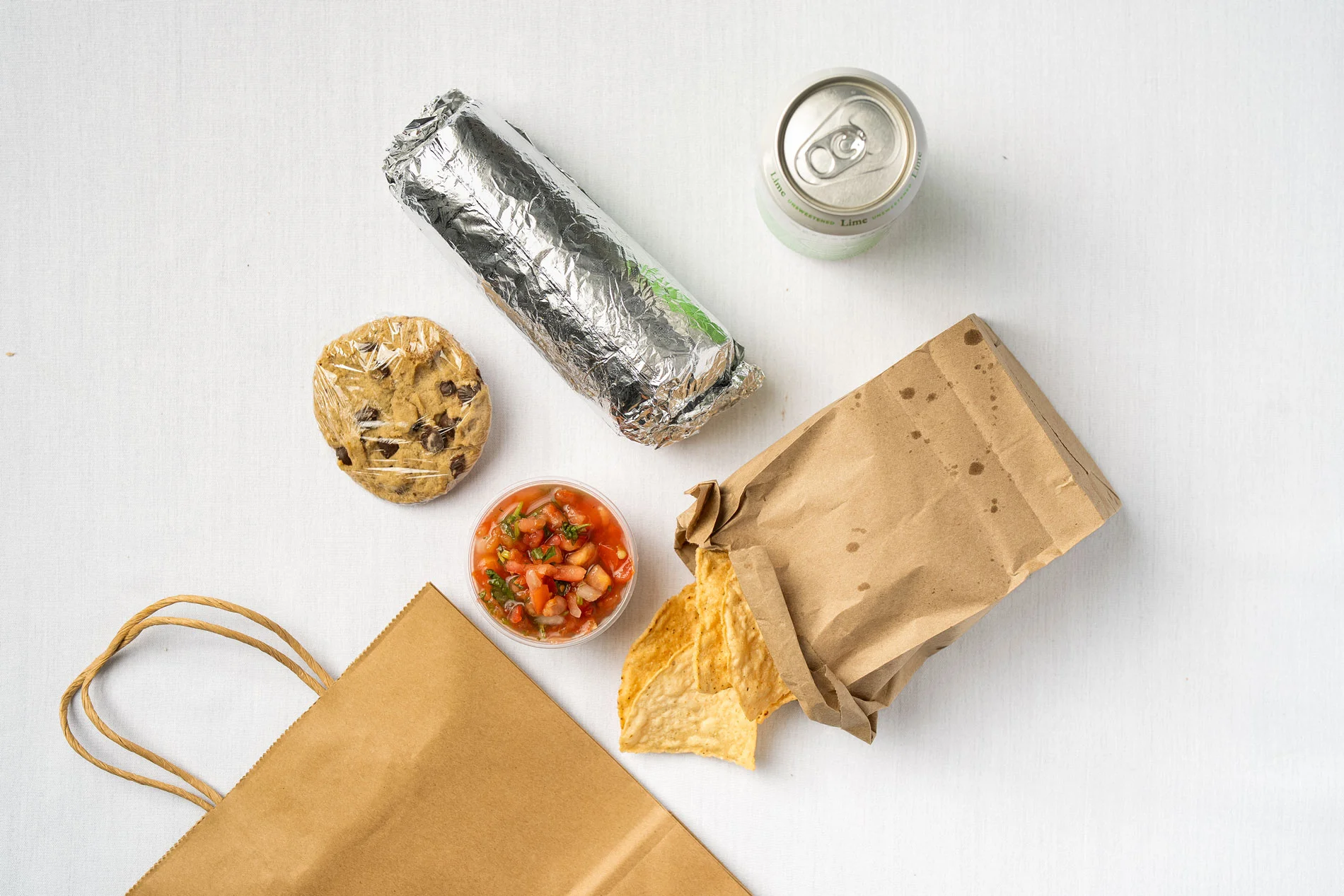 Delicious burrito with salsa and tortilla chips