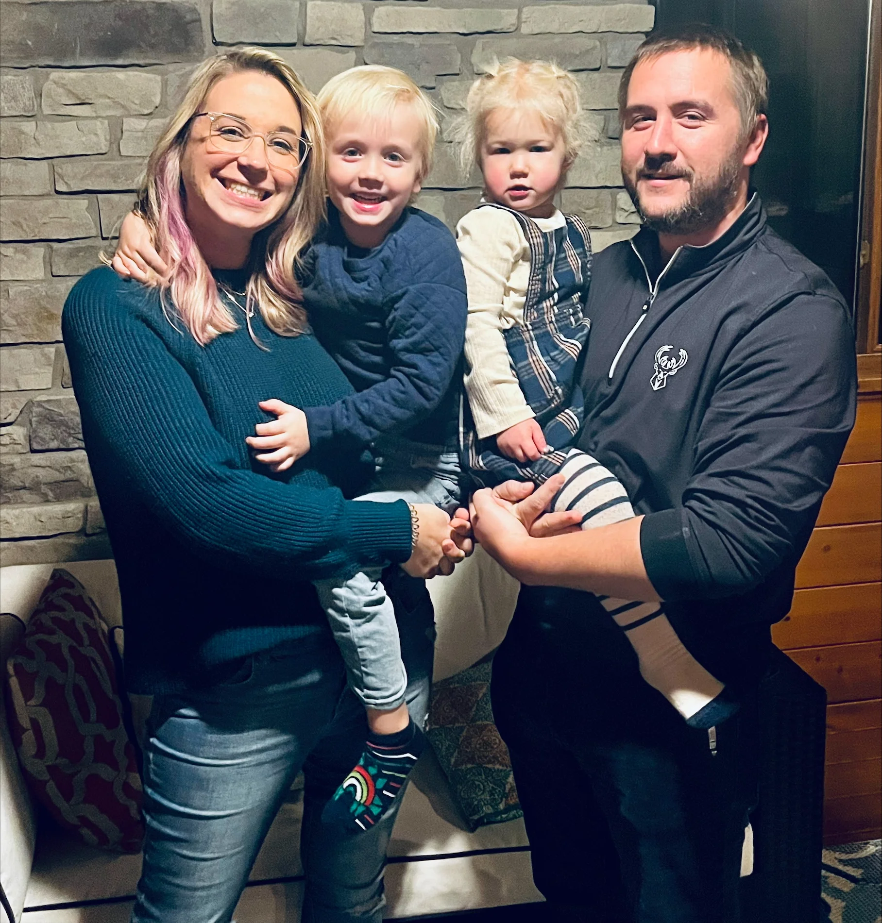 Family portrait with two children in a cozy setting
