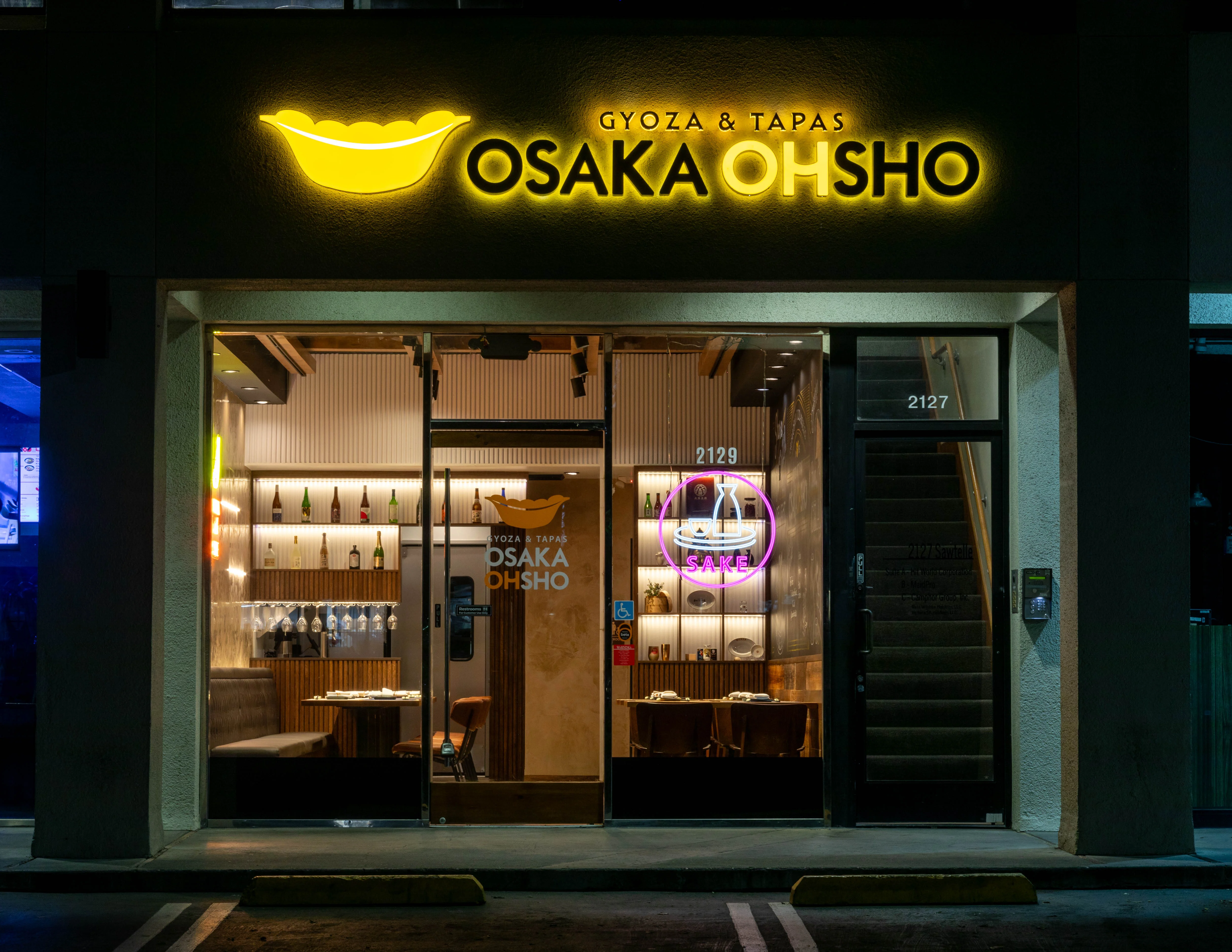 Exterior view of Osaka Ohsho restaurant with neon signage