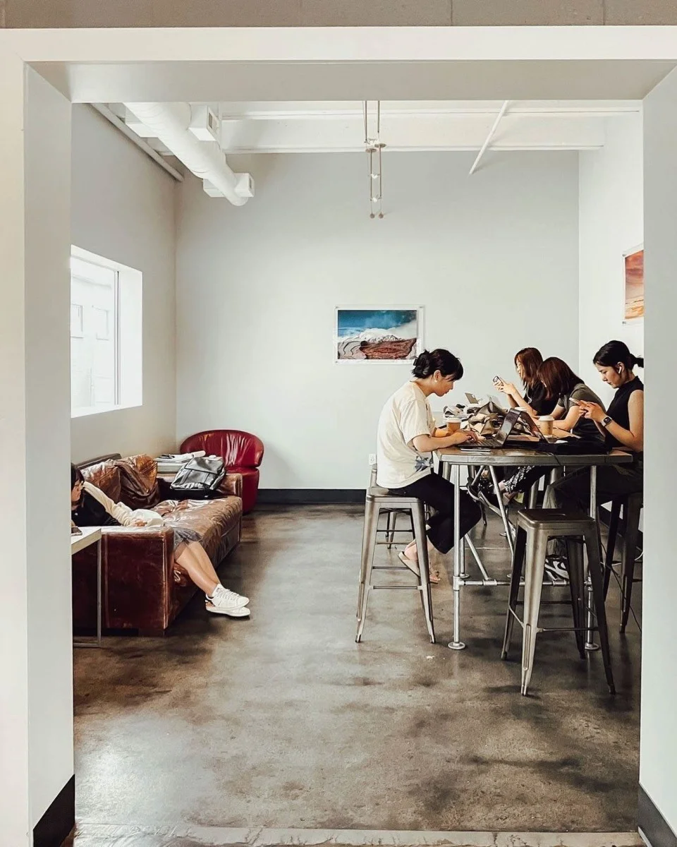 Modern café interior with patrons working and relaxing