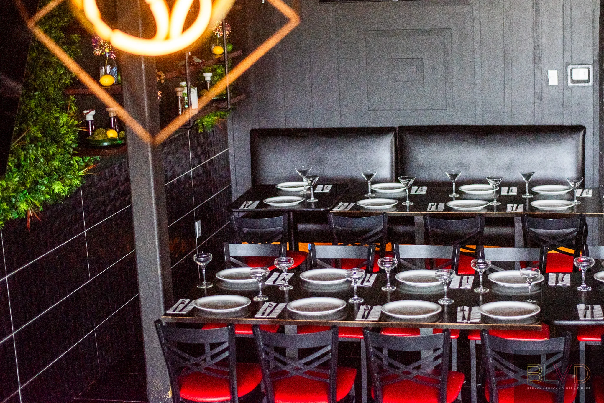 Stylish restaurant interior with black seating and elegant table settings