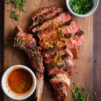 Grilled tomahawk steak with chimichurri sauce