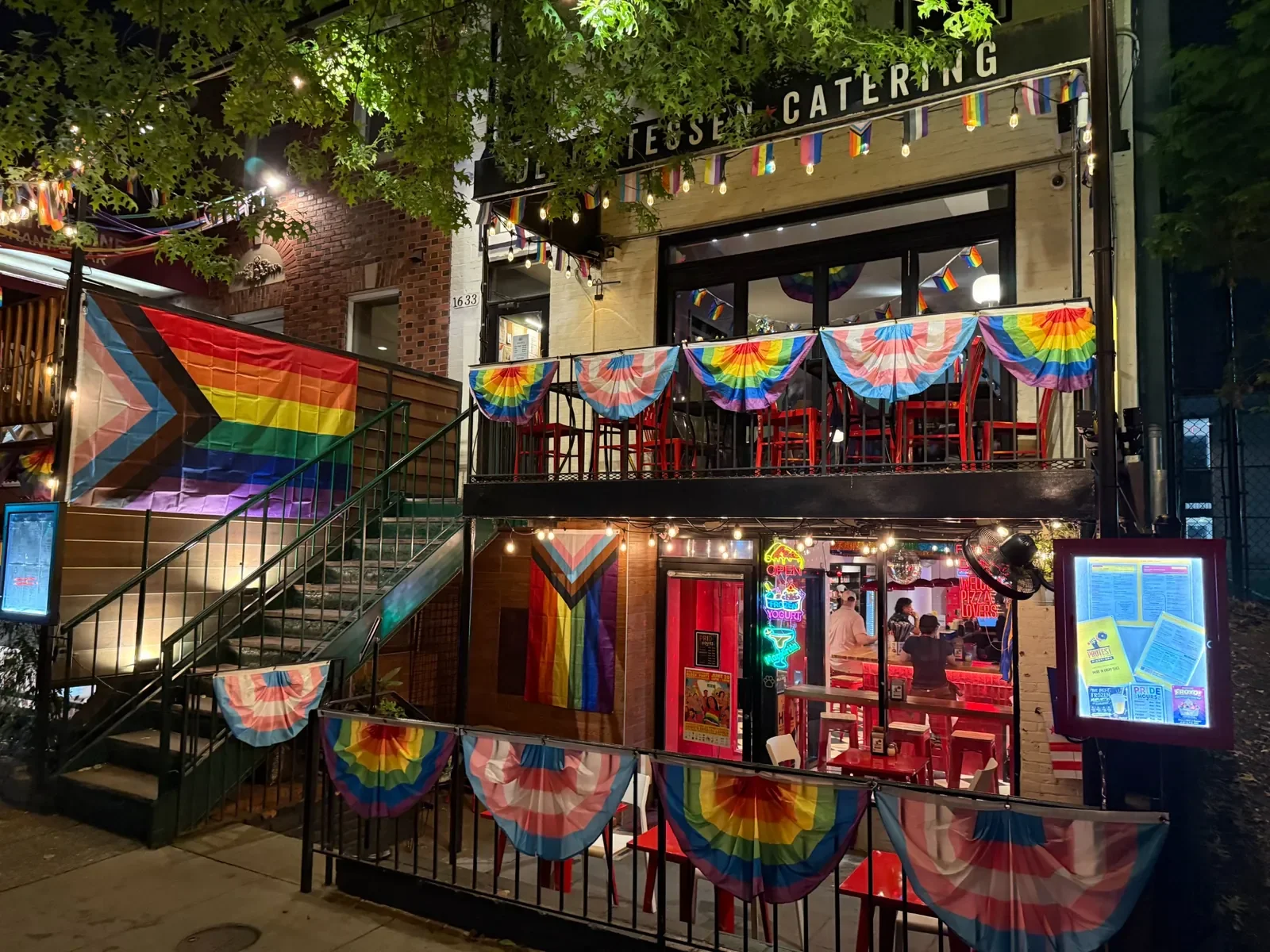 Vibrant restaurant exterior decorated for Pride celebrations