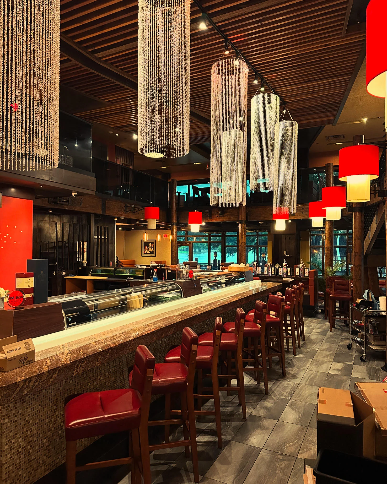Stylish restaurant interior with modern lighting and bar seating