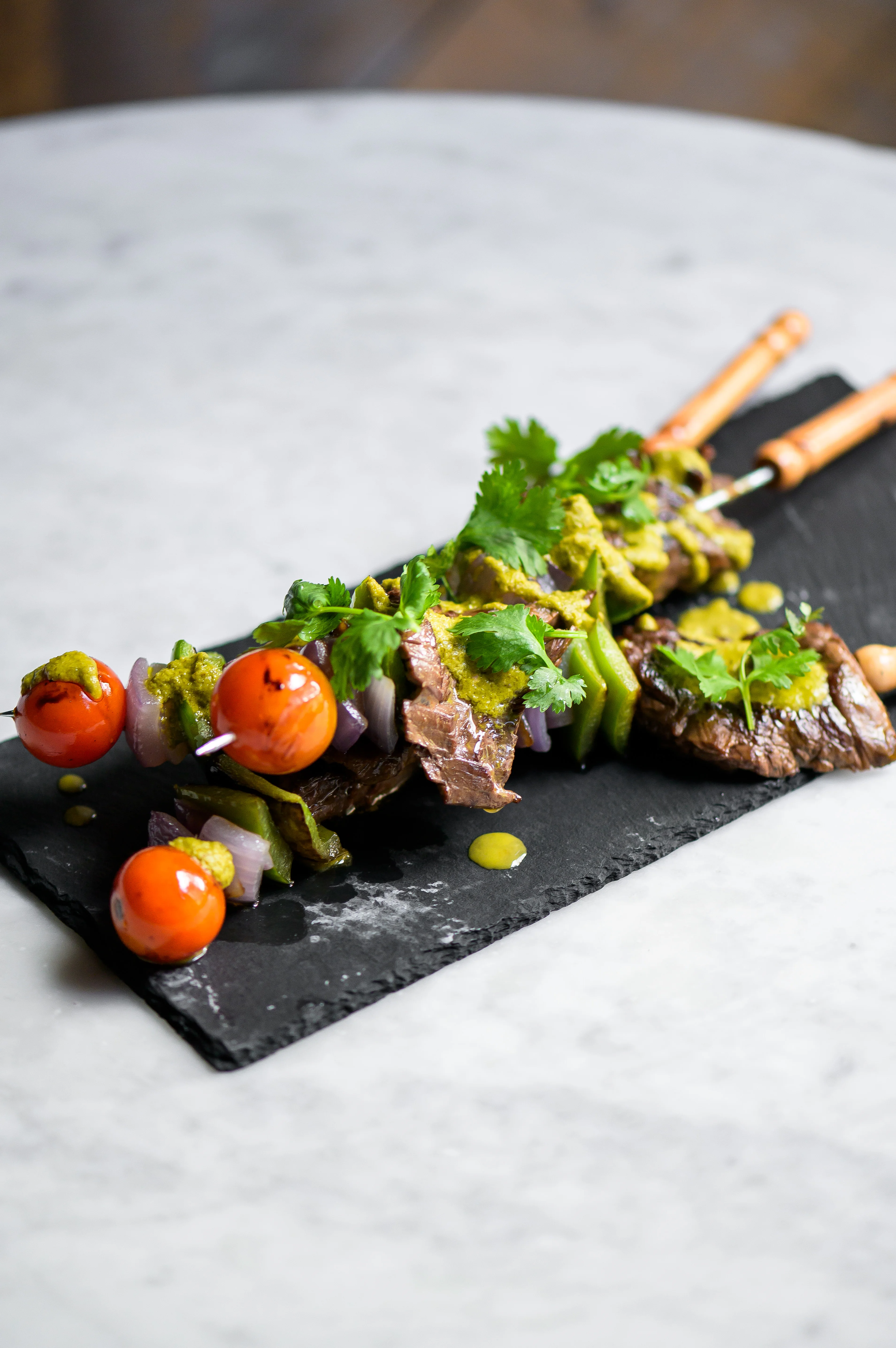 Grilled kebabs with marinated beef and vegetables