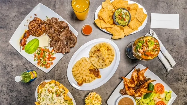 Delicious Mexican feast with tacos, shrimp, and guacamole