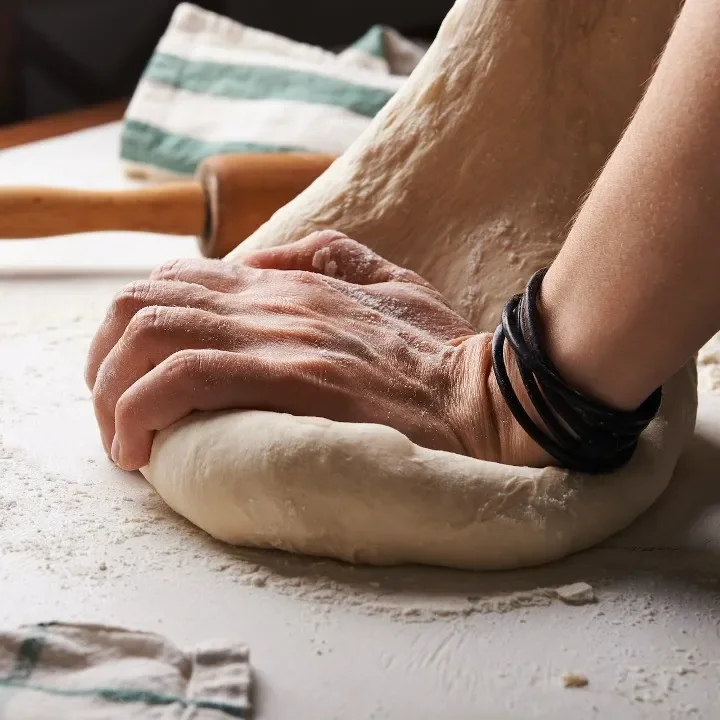 Kneading dough for artisan bread preparation