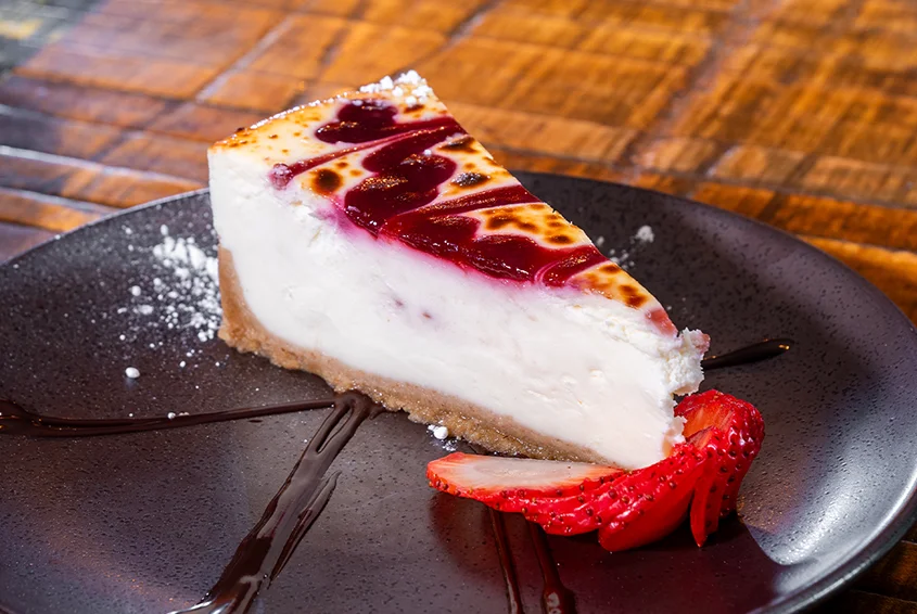 Classic New York cheesecake with berry sauce