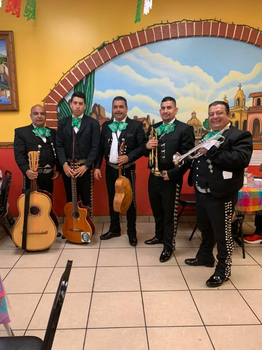 Mariachi band performing in a vibrant restaurant