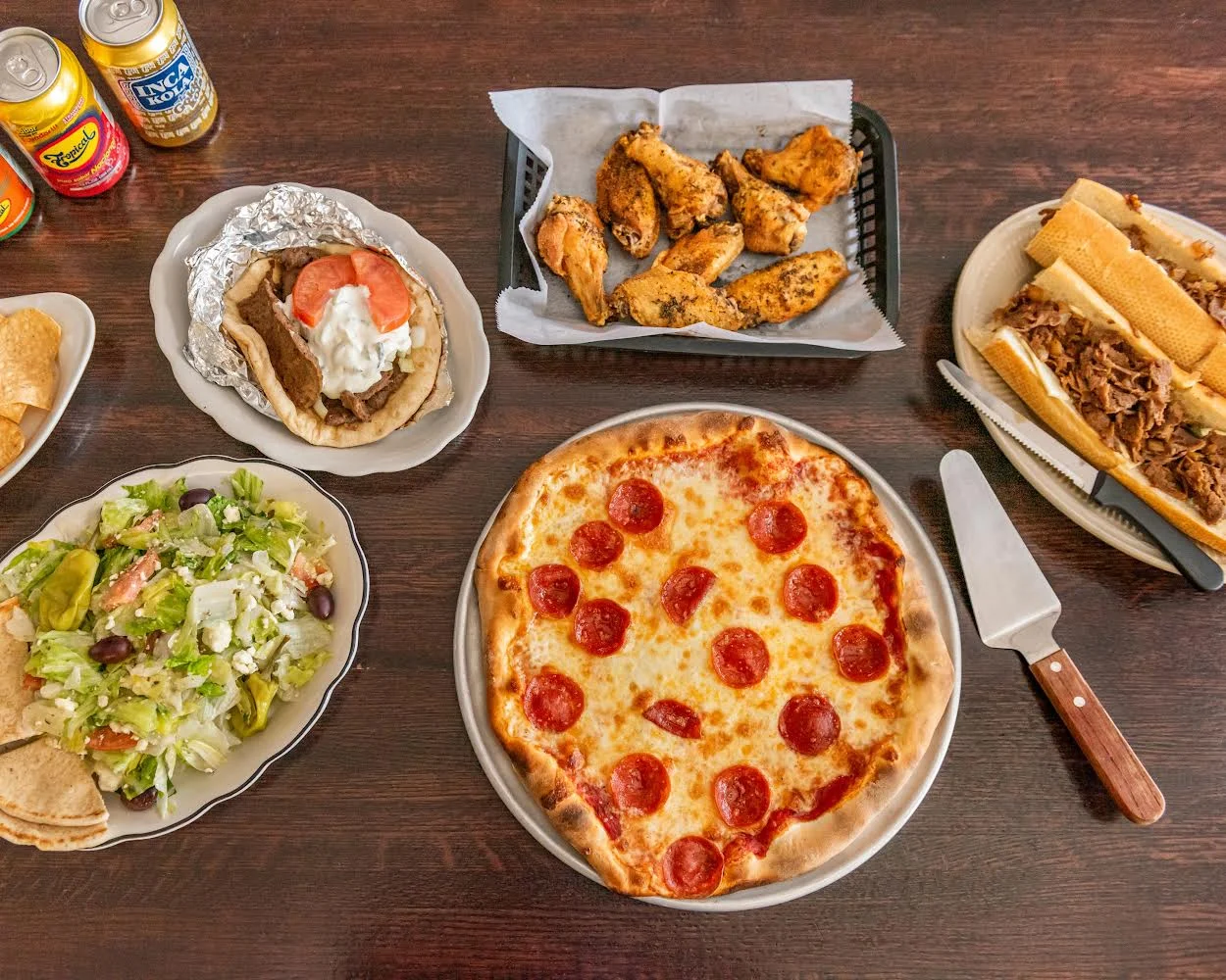 Variety of comfort foods including pepperoni pizza and wings