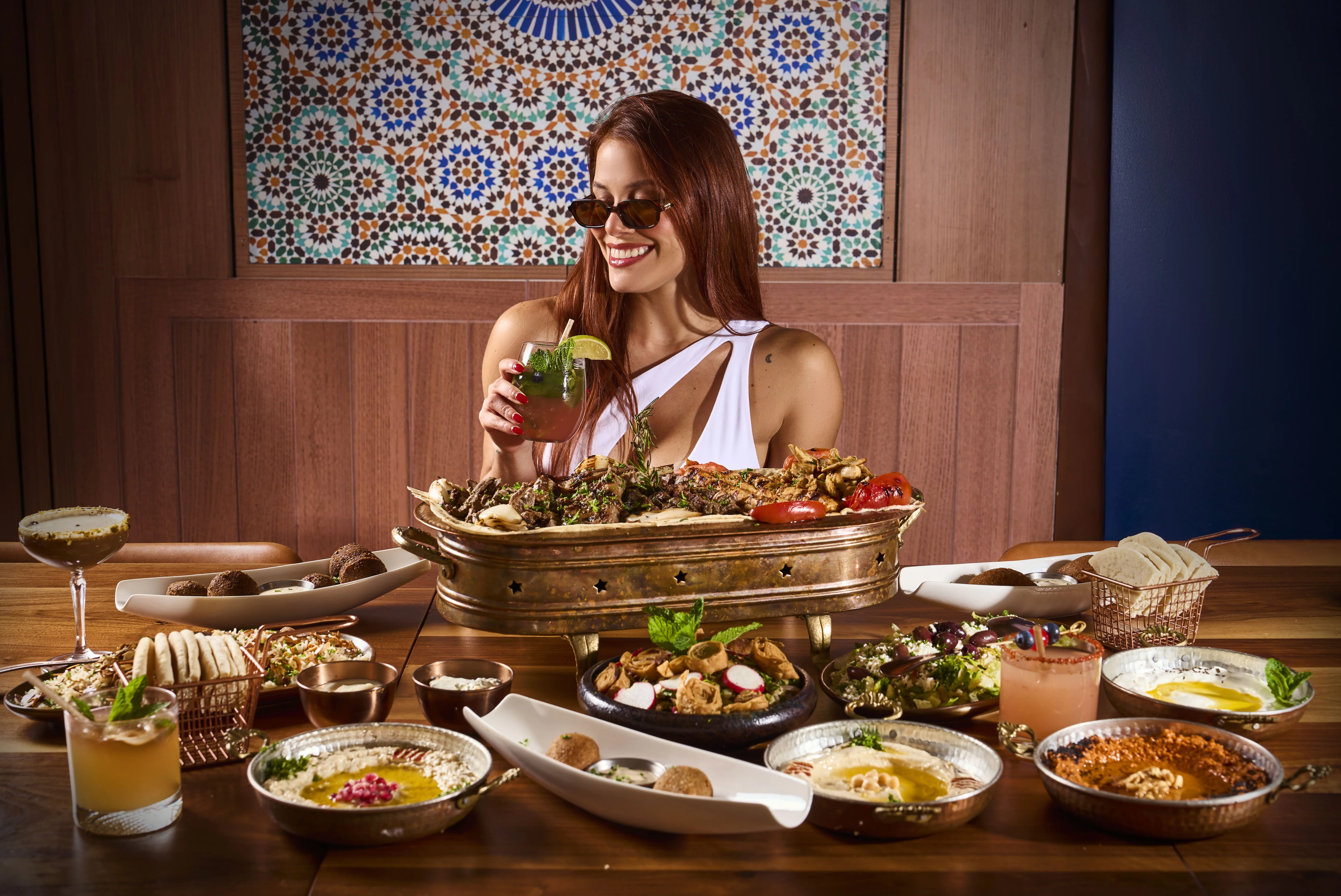 Delicious shawarma platter with fresh vegetables and sauces