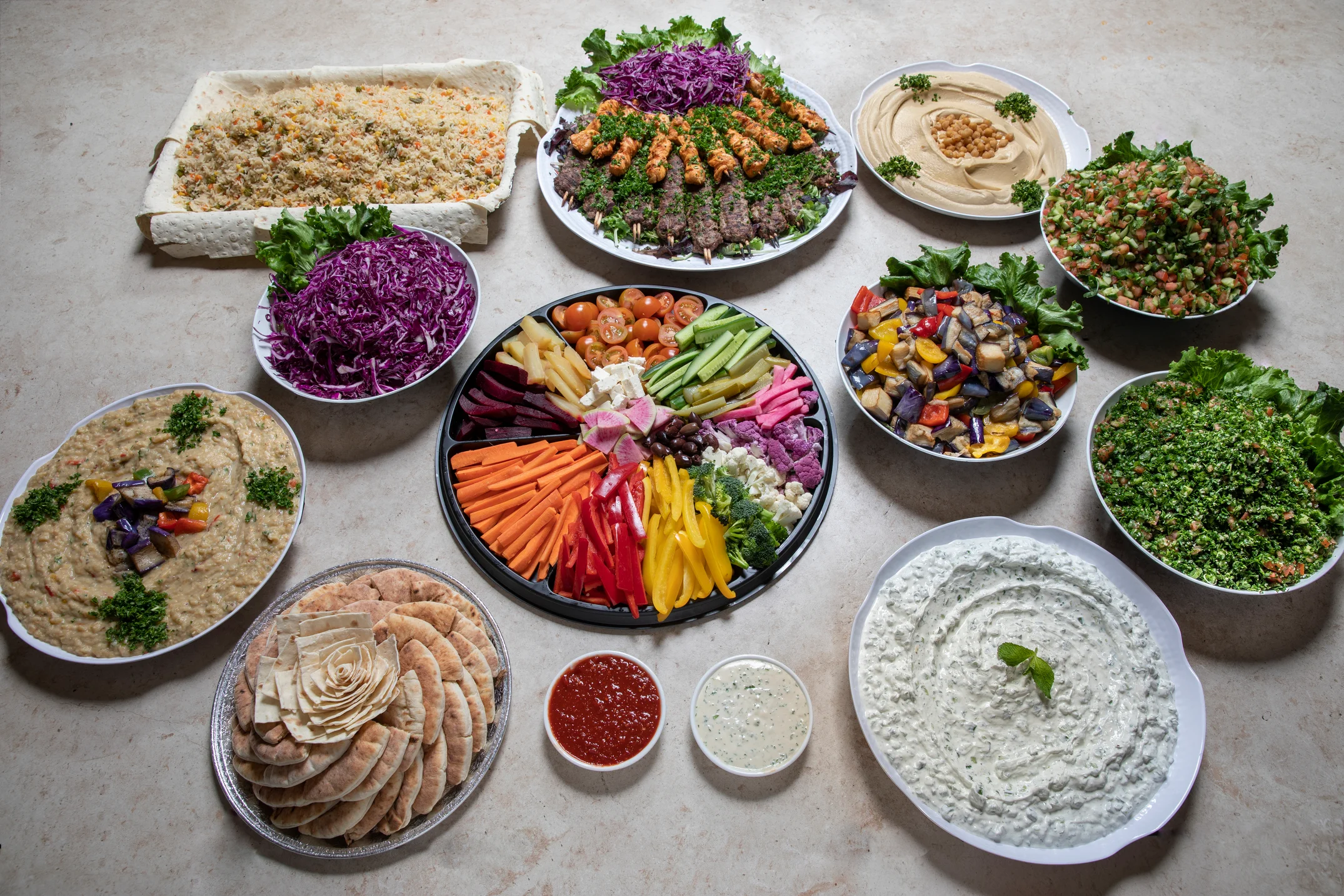 Mediterranean mezze platter with assorted dips and fresh vegetables