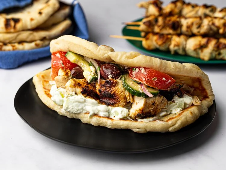 Chicken souvlaki with tzatziki sauce and Greek salad