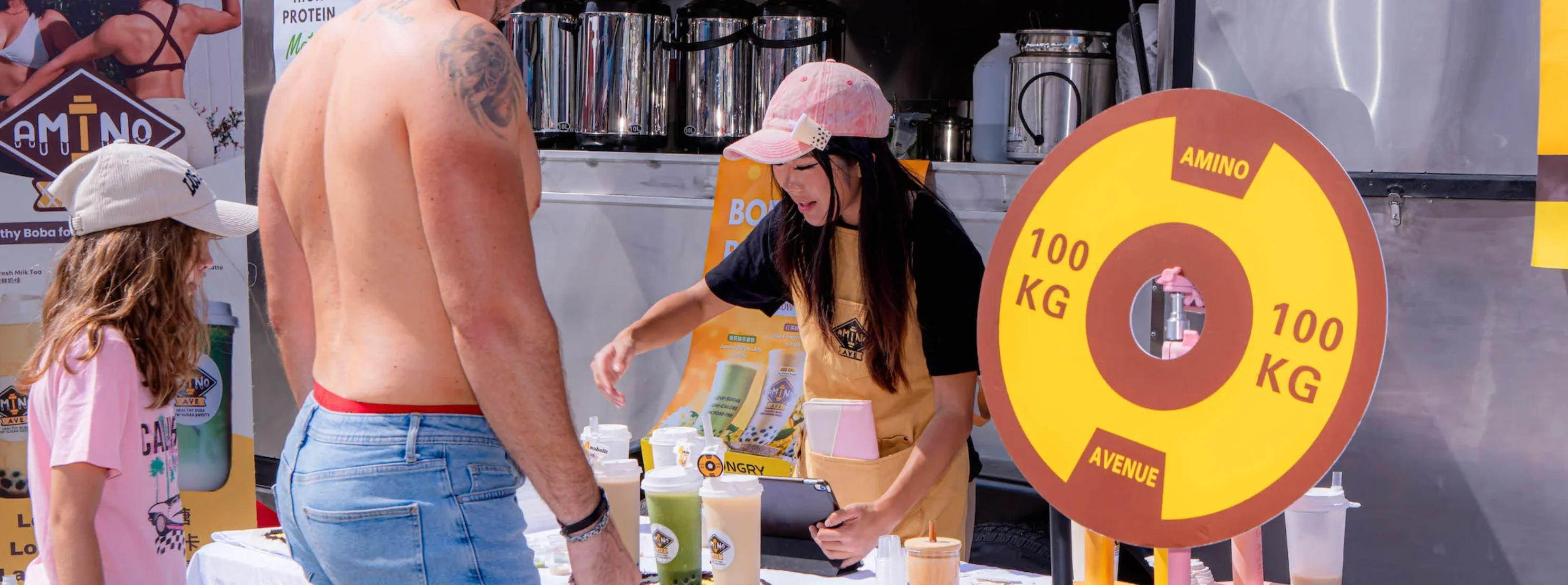 Vendor serving boba tea at a food festival