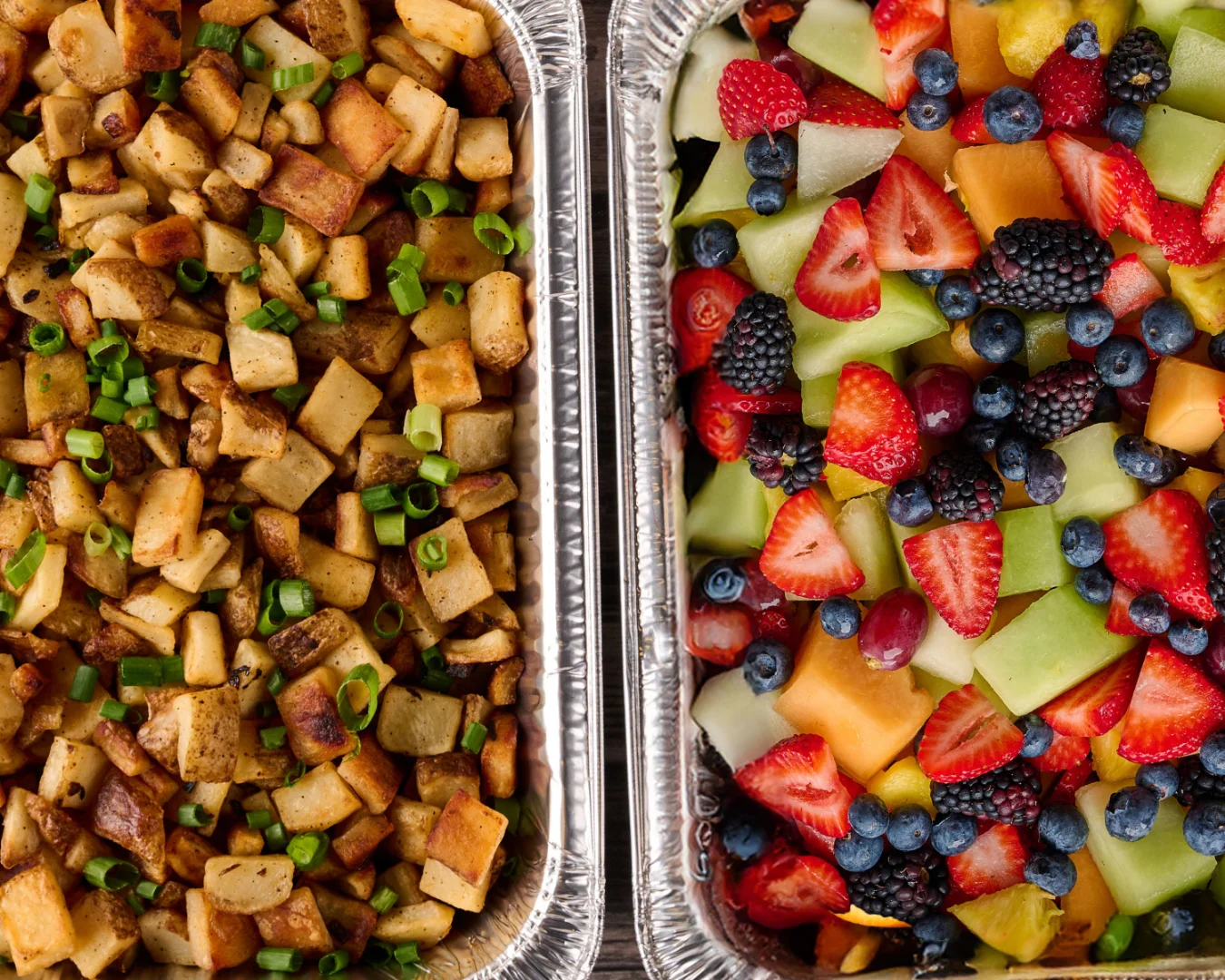 A beautifully arranged catering spread with various dishes and garnishes.