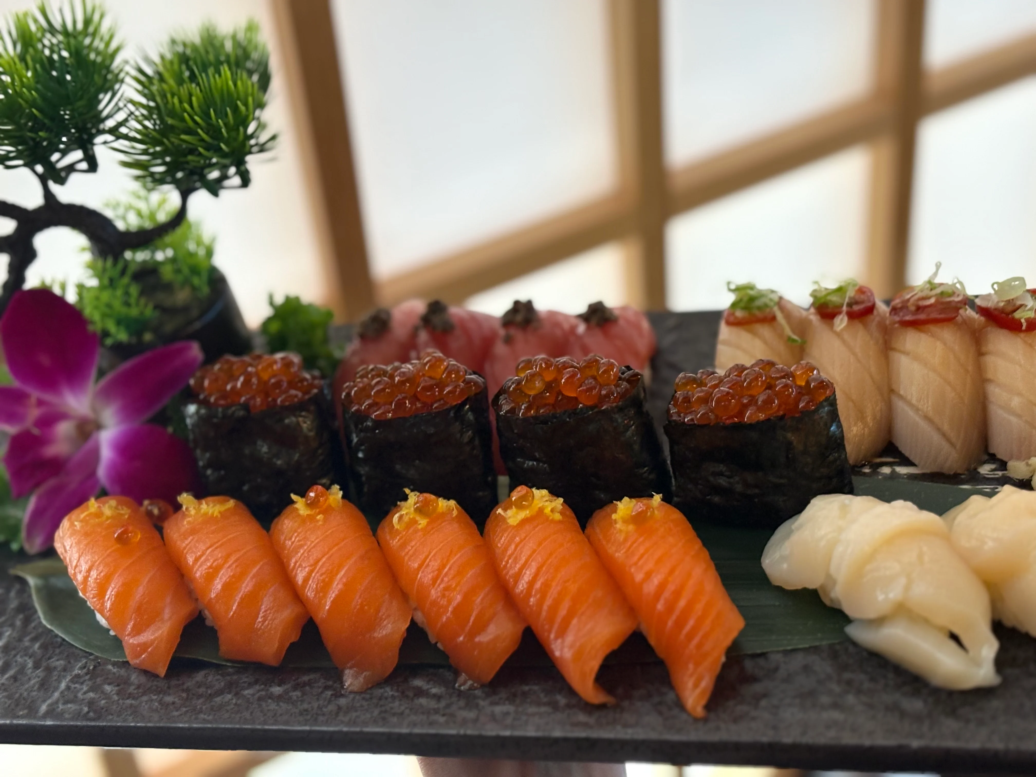 Assorted sushi platter featuring nigiri and maki rolls