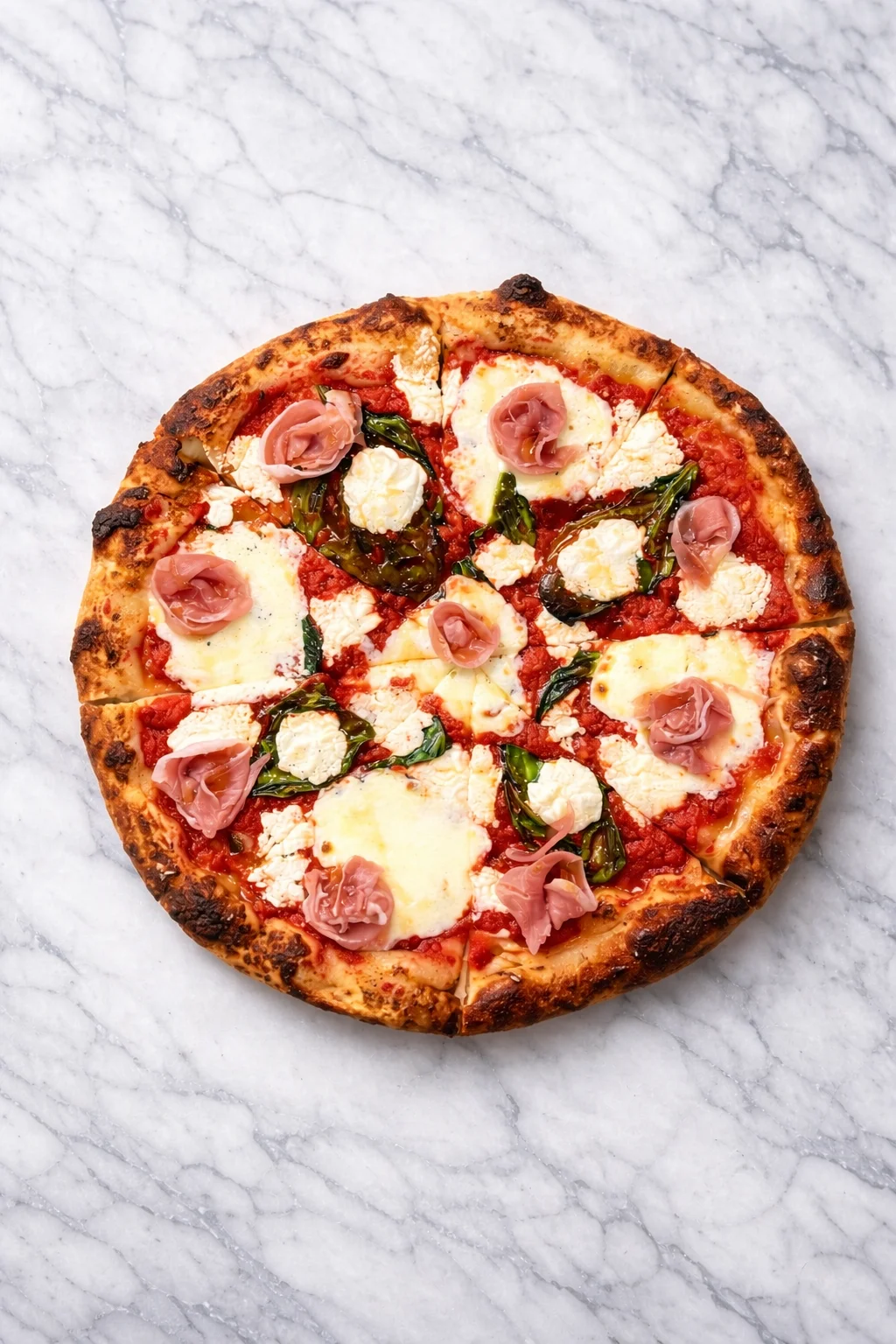 Italian prosciutto pizza with fresh mozzarella and basil