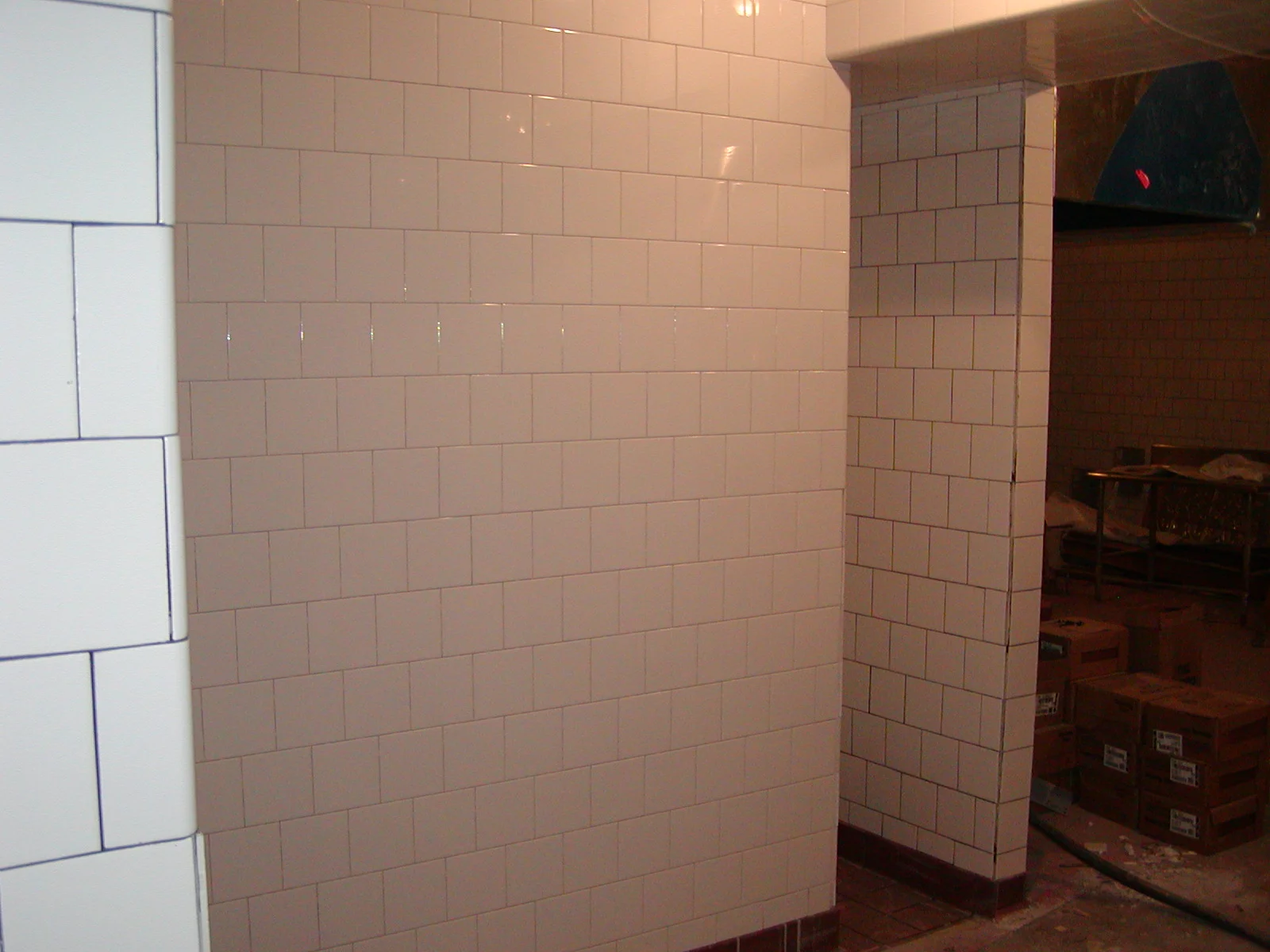 Clean tiled walls in a restaurant kitchen under renovation