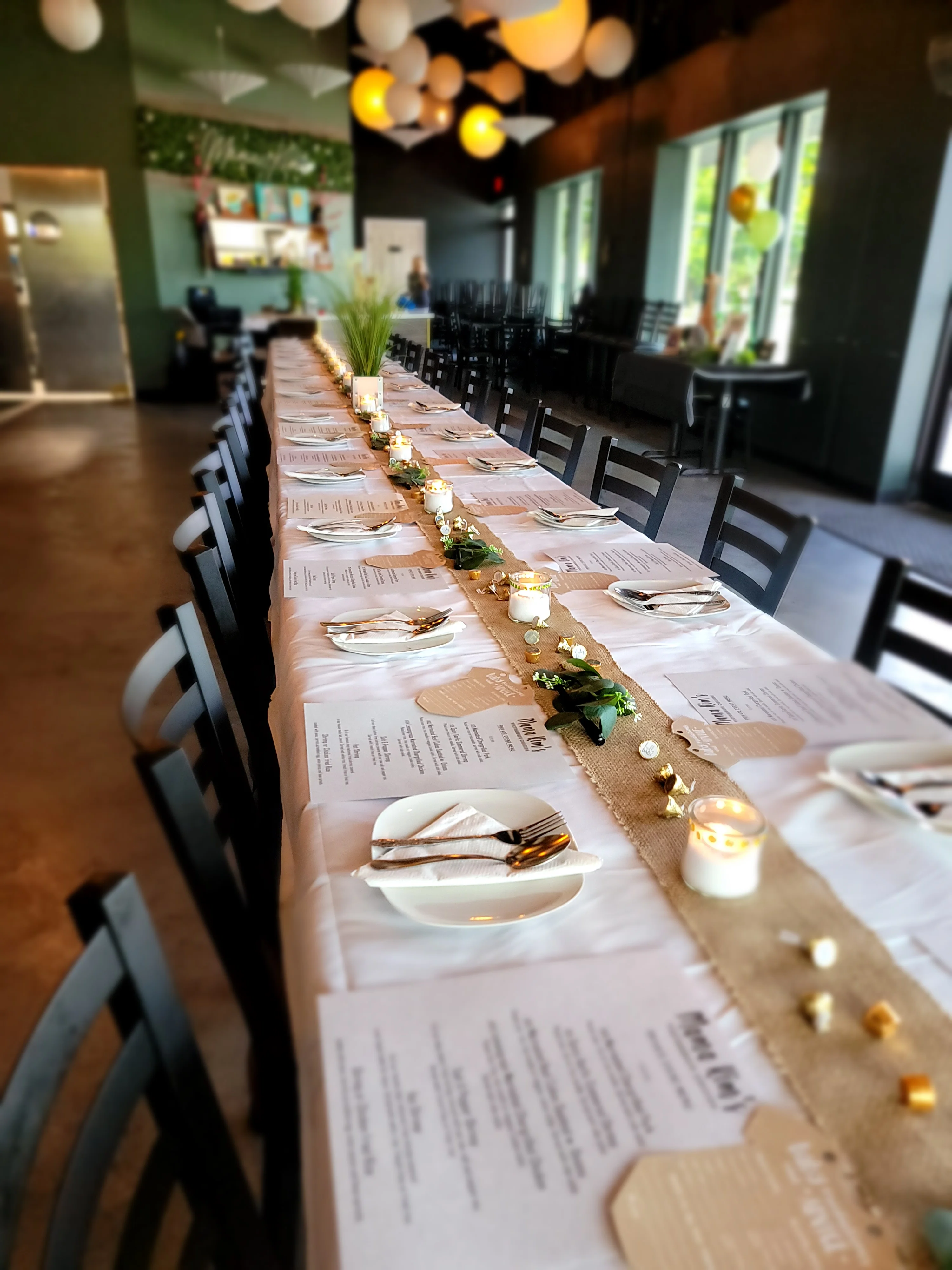 A table prepped with menus and utensils