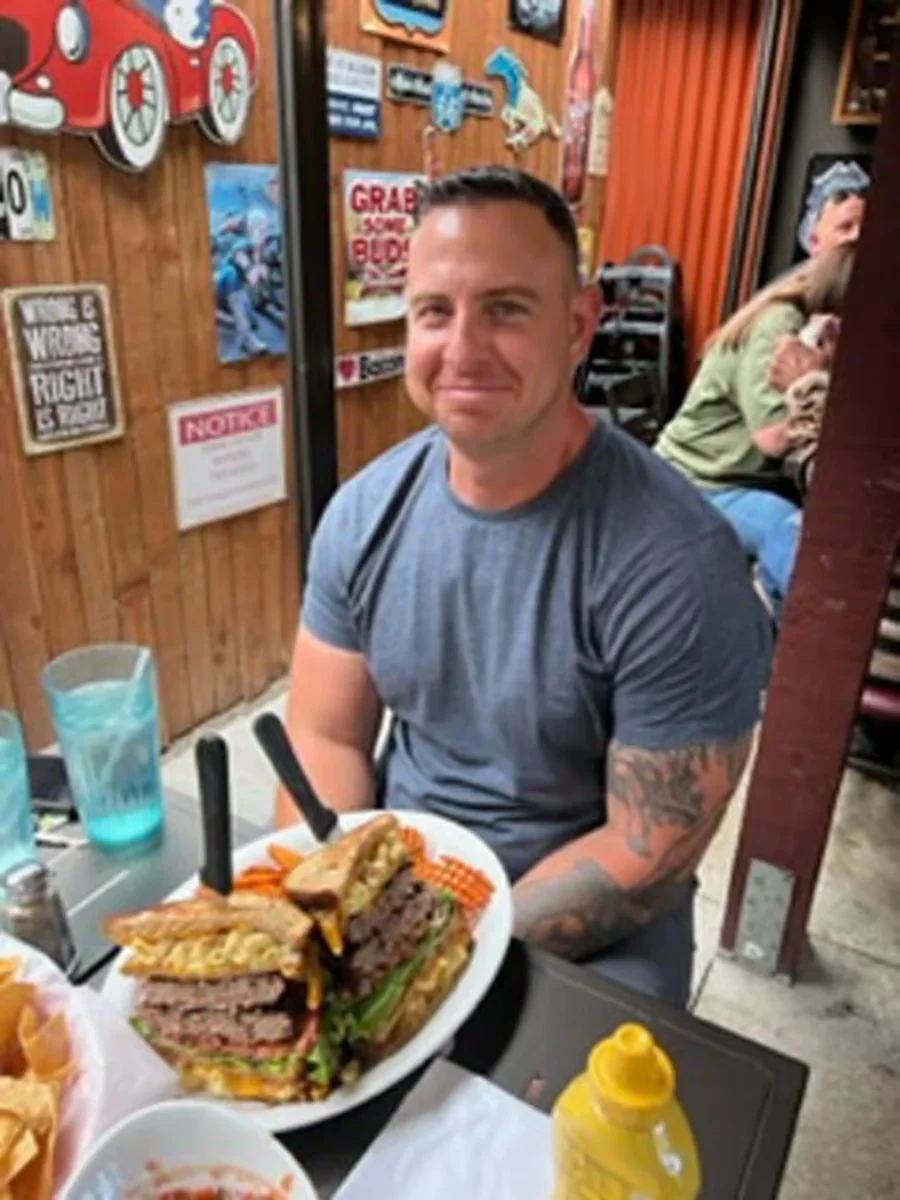 Giant American cheeseburger with fries in a casual dining setting