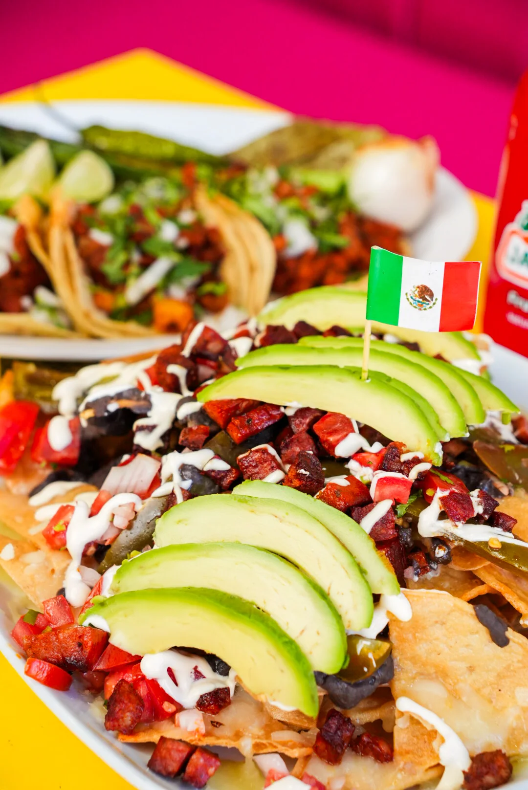 Loaded nachos with avocado and Mexican flag