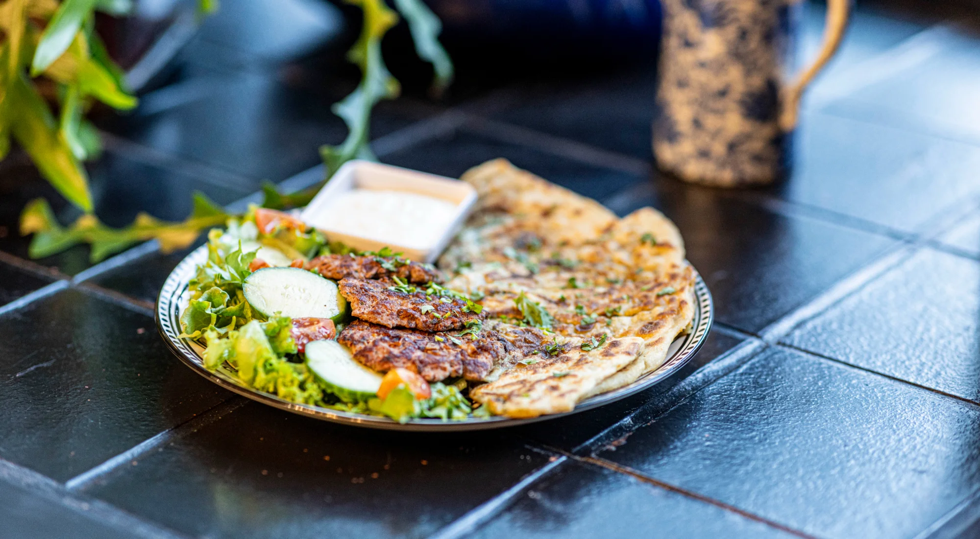 Delicious Turkish gözleme with salad and yogurt sauce