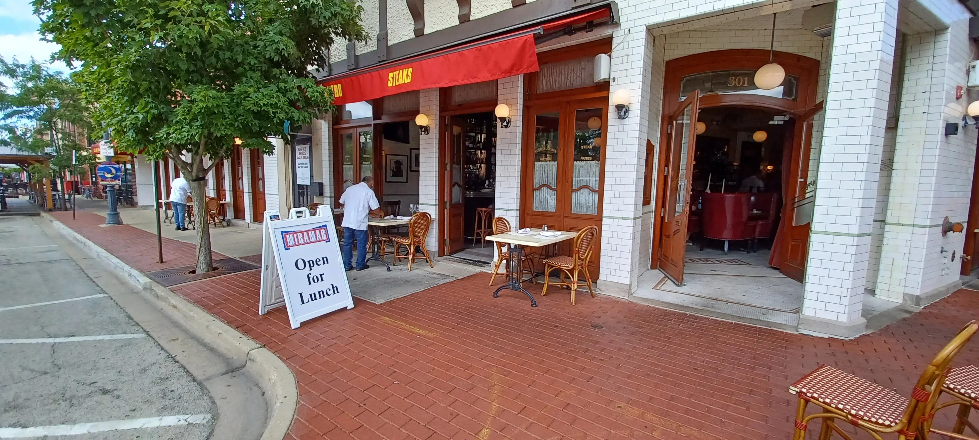 Charming restaurant exterior with outdoor seating and welcoming signage
