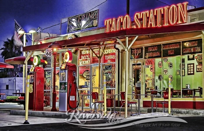 Colorful taco restaurant exterior at dusk