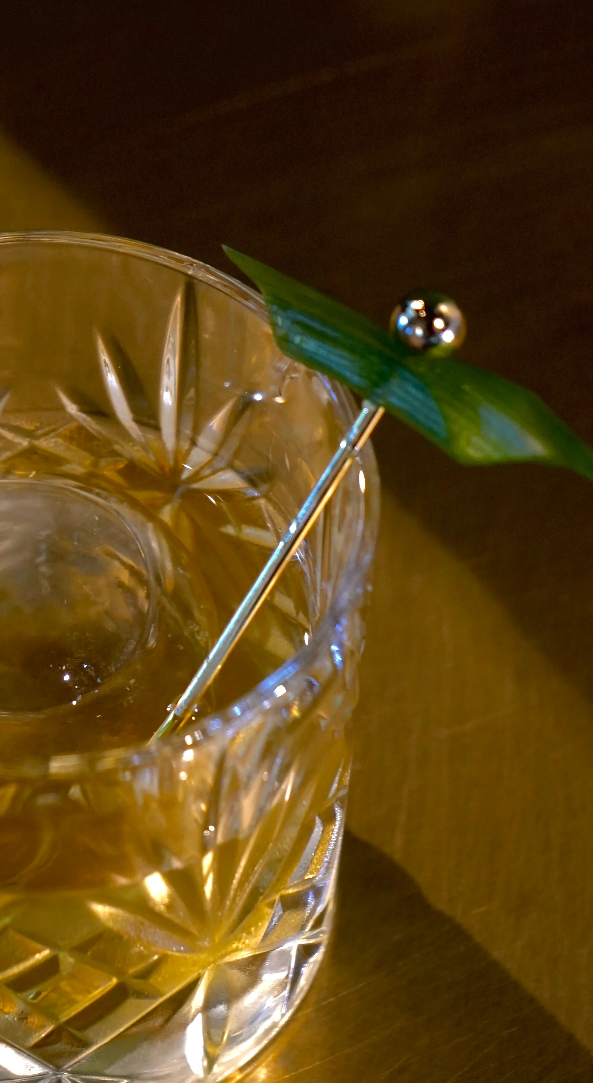 Elegant cocktail served in a crystal glass with a decorative garnish