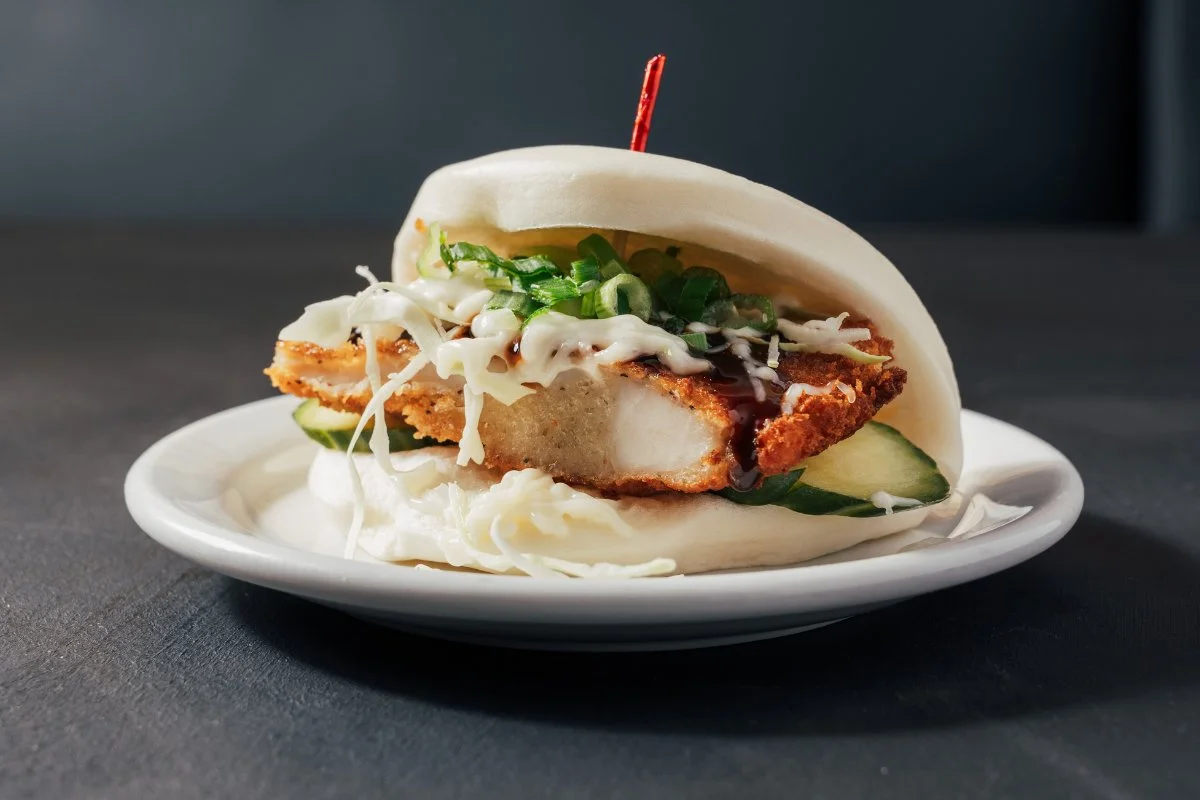 Crispy chicken sandwich on a bun with lettuce and sauce