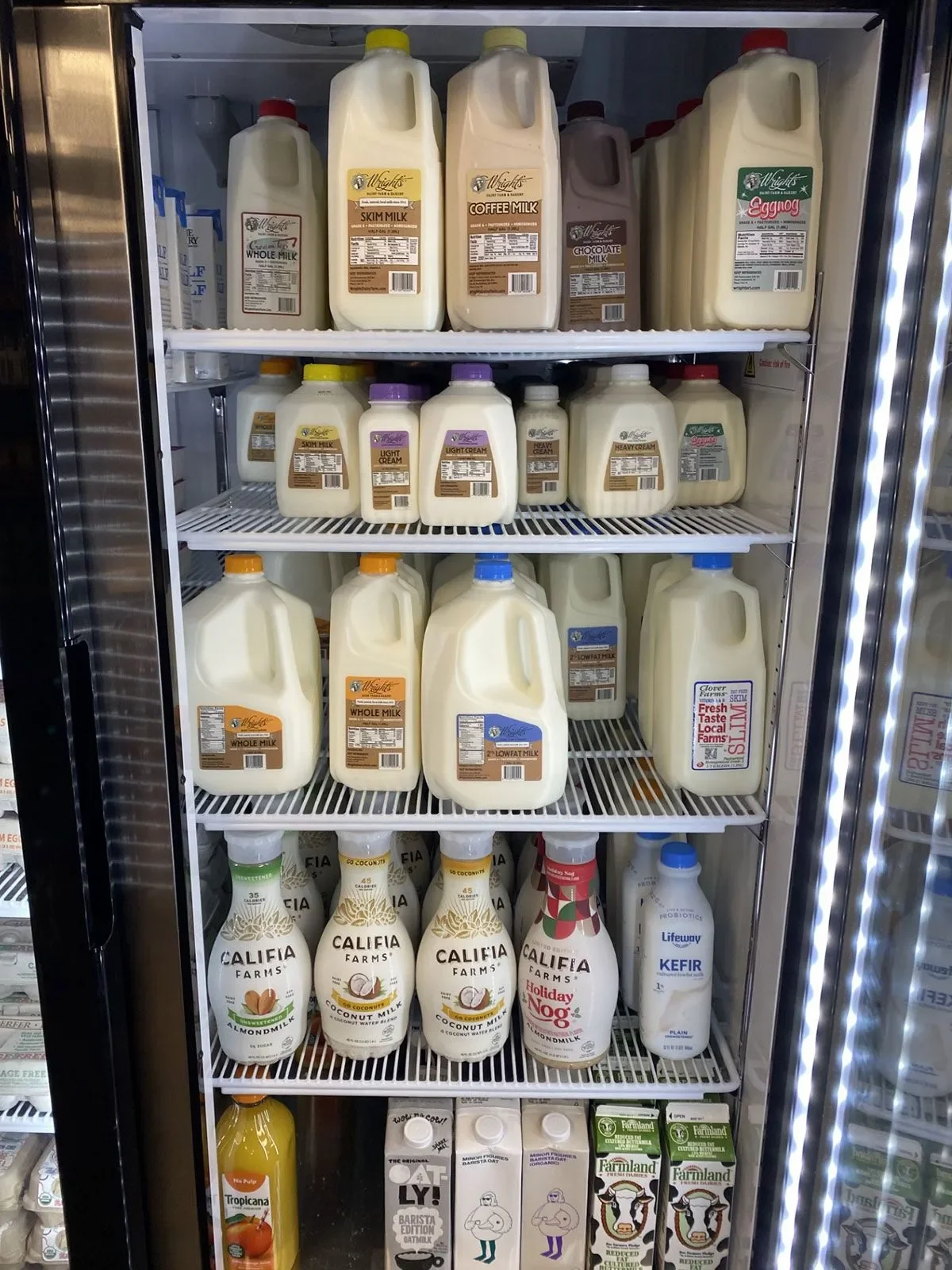 Refrigerator stocked with various milk and dairy alternatives