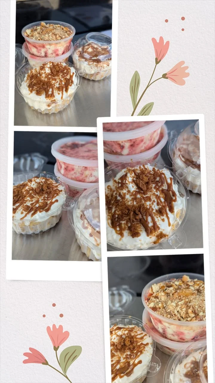Four stacked tubs filled with layers of dessert, featuring cream and pieces of red cake.