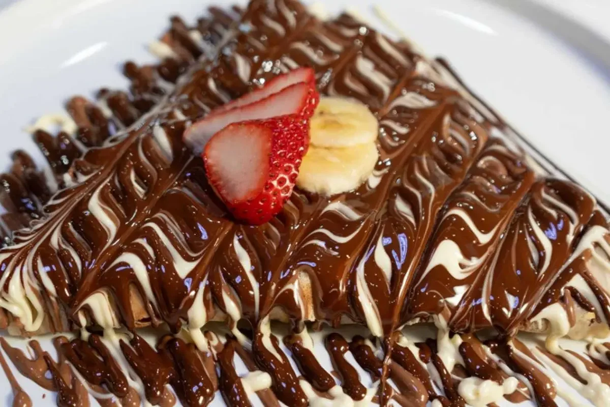Decadent chocolate crepe with strawberries and bananas