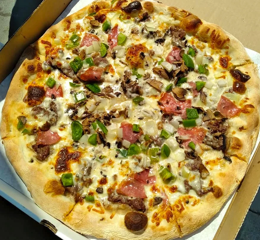 Loaded meat lover's pizza with fresh toppings