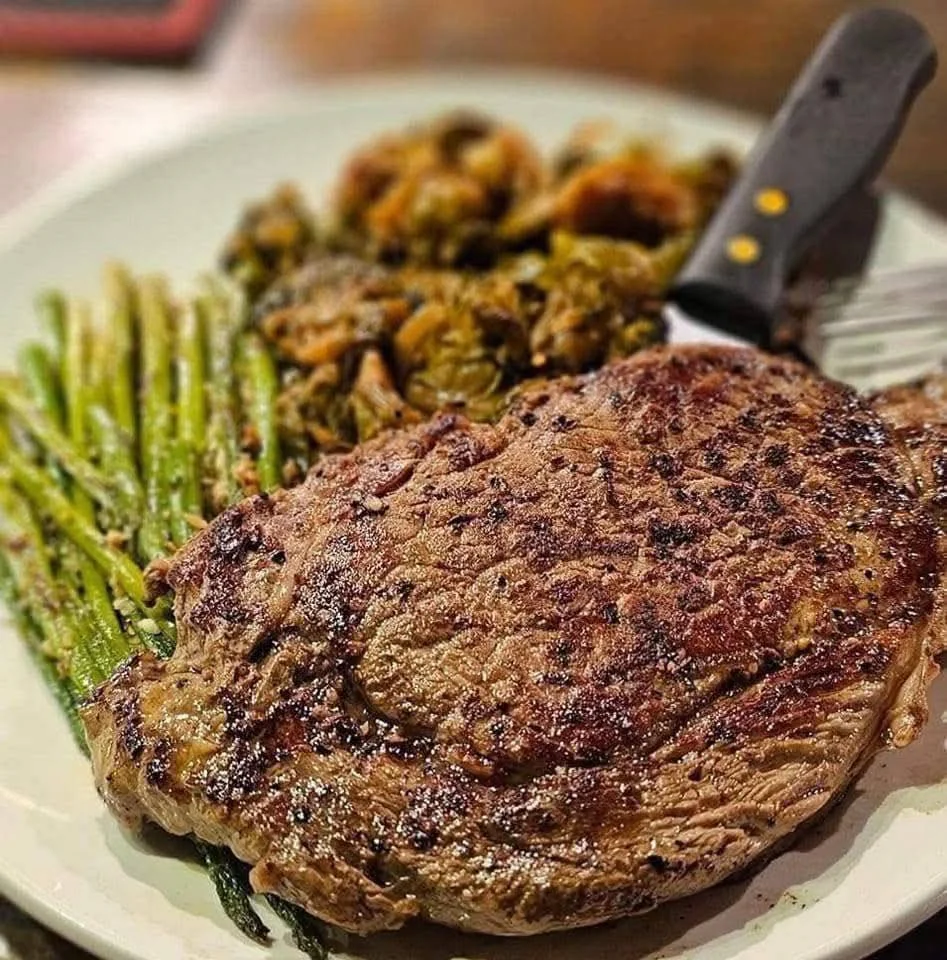 Grilled ribeye steak with asparagus and Brussels sprouts