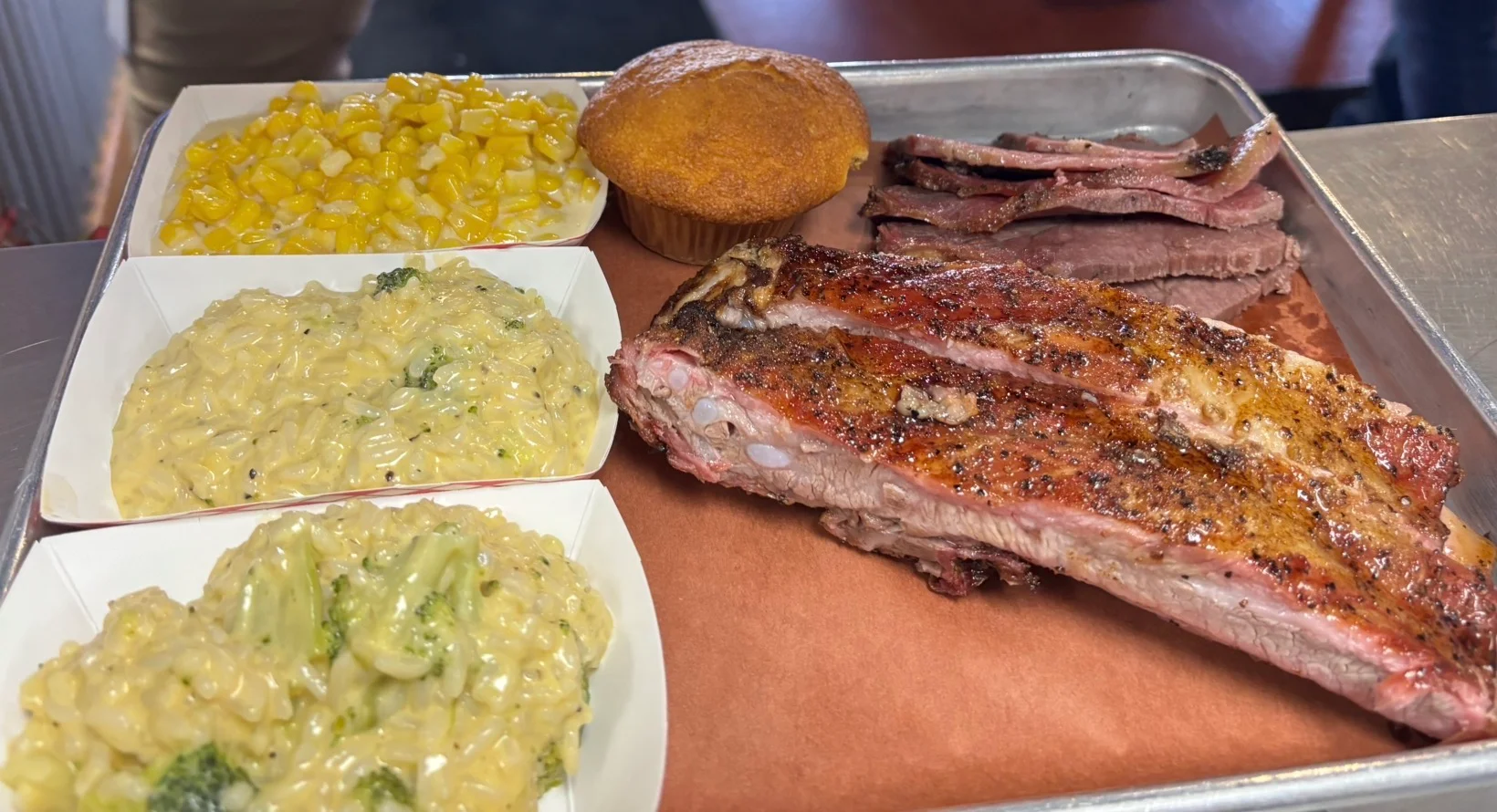 Rusty Bucket BBQ plate with smoked meat and homestyle sides