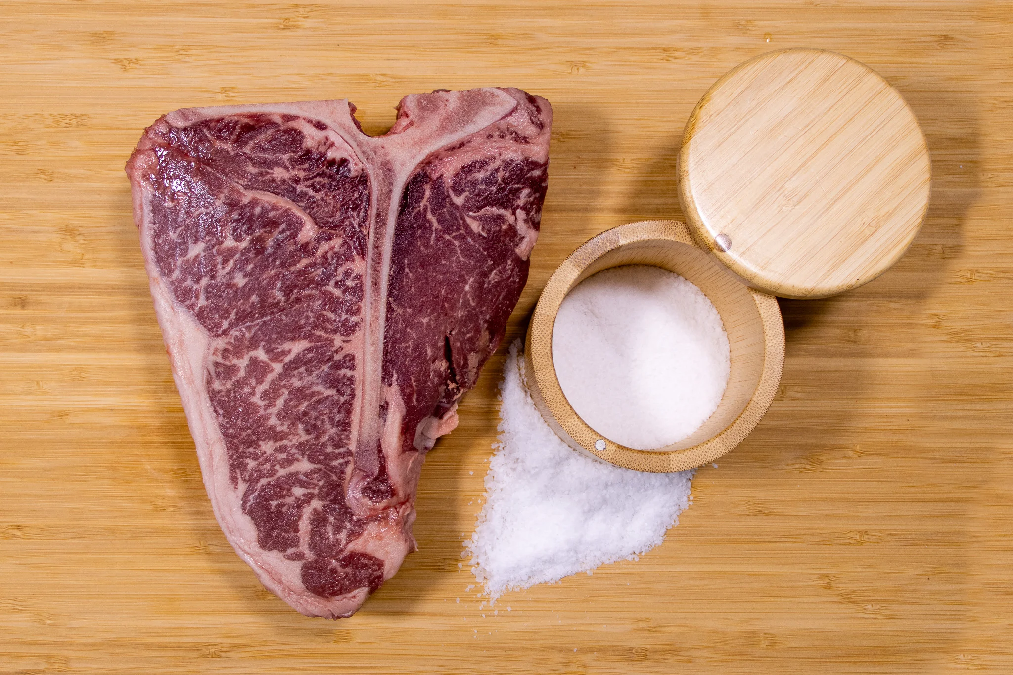 Raw ribeye steak ready for grilling