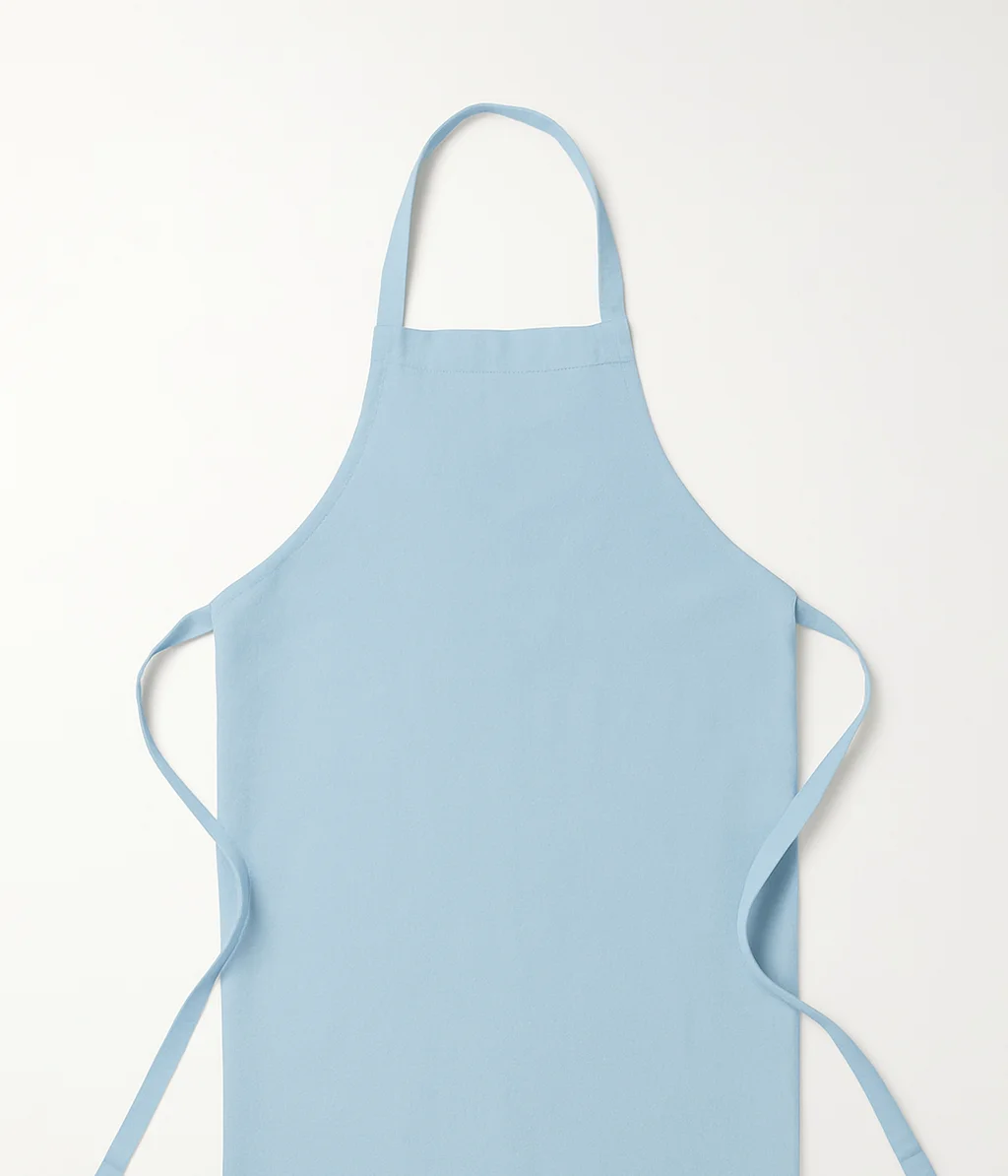 Light blue cooking apron on a neutral background