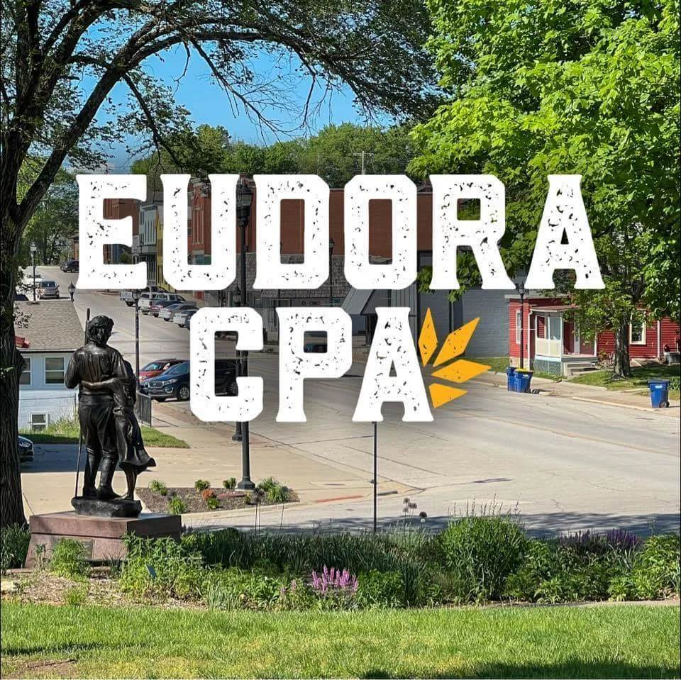 View of Eudora, Kansas with a statue and vibrant greenery