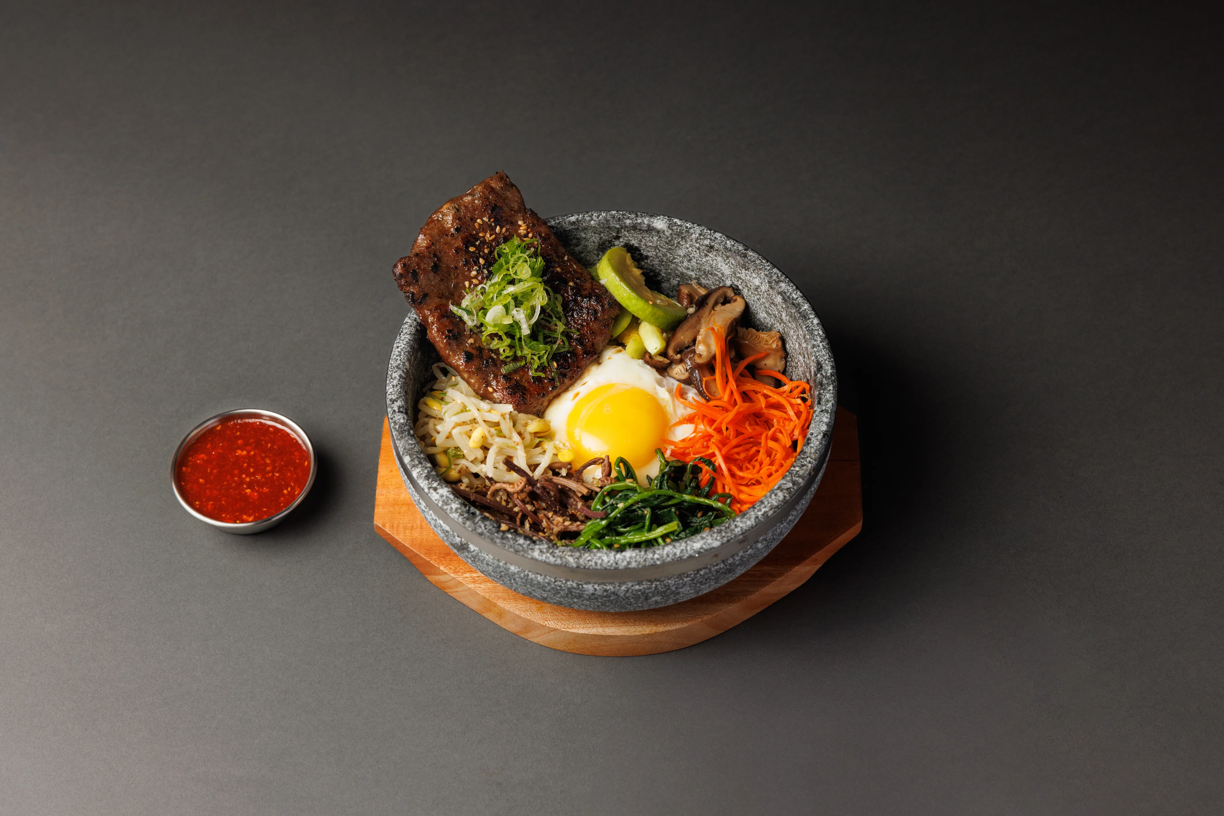 Korean bibimbap served in a hot stone bowl