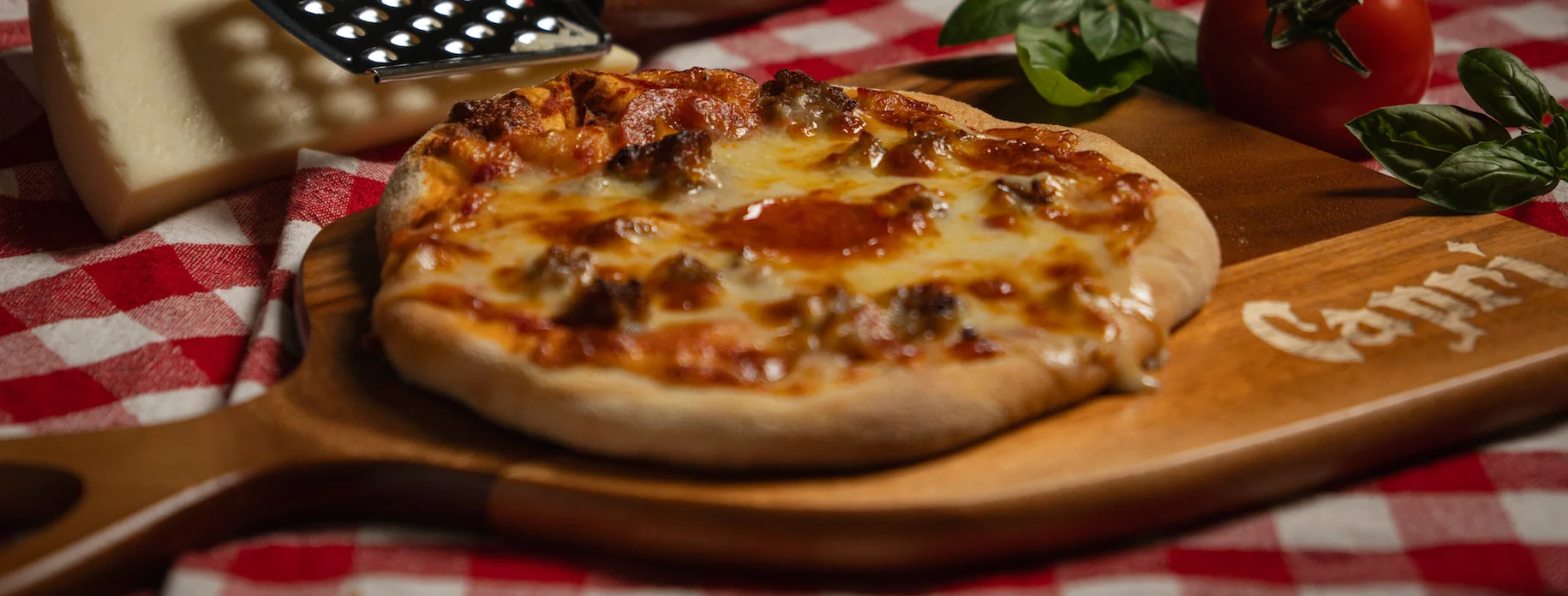 Delicious pepperoni pizza on a wooden board
