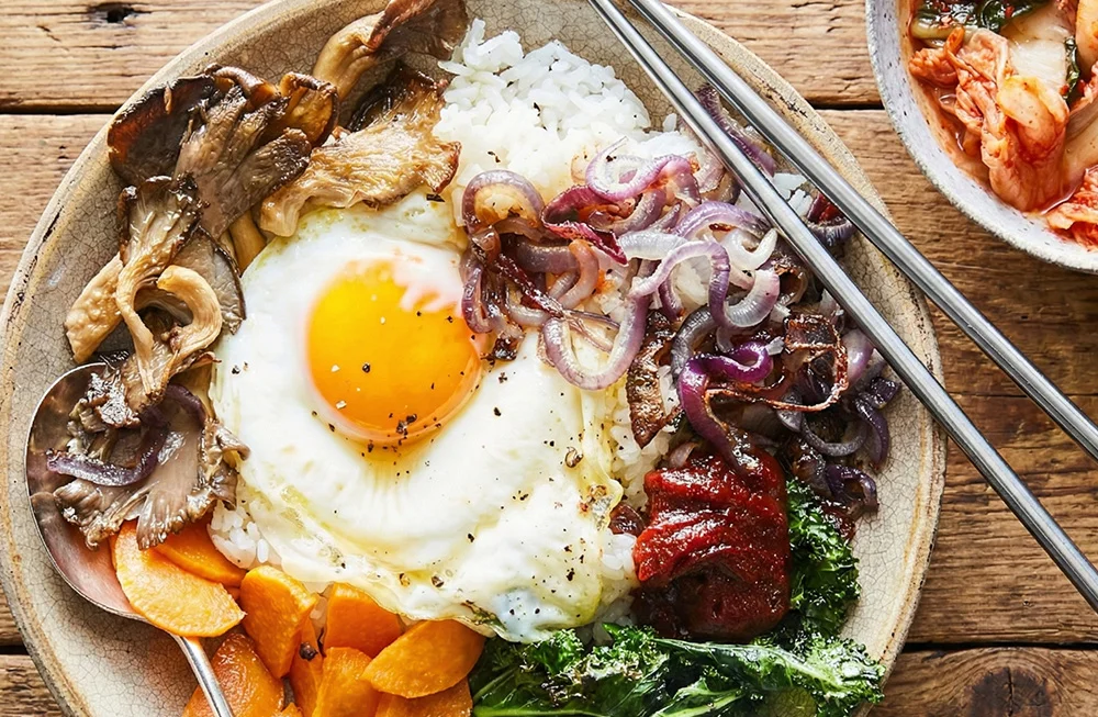 Korean bibimbap with fried egg and vegetables