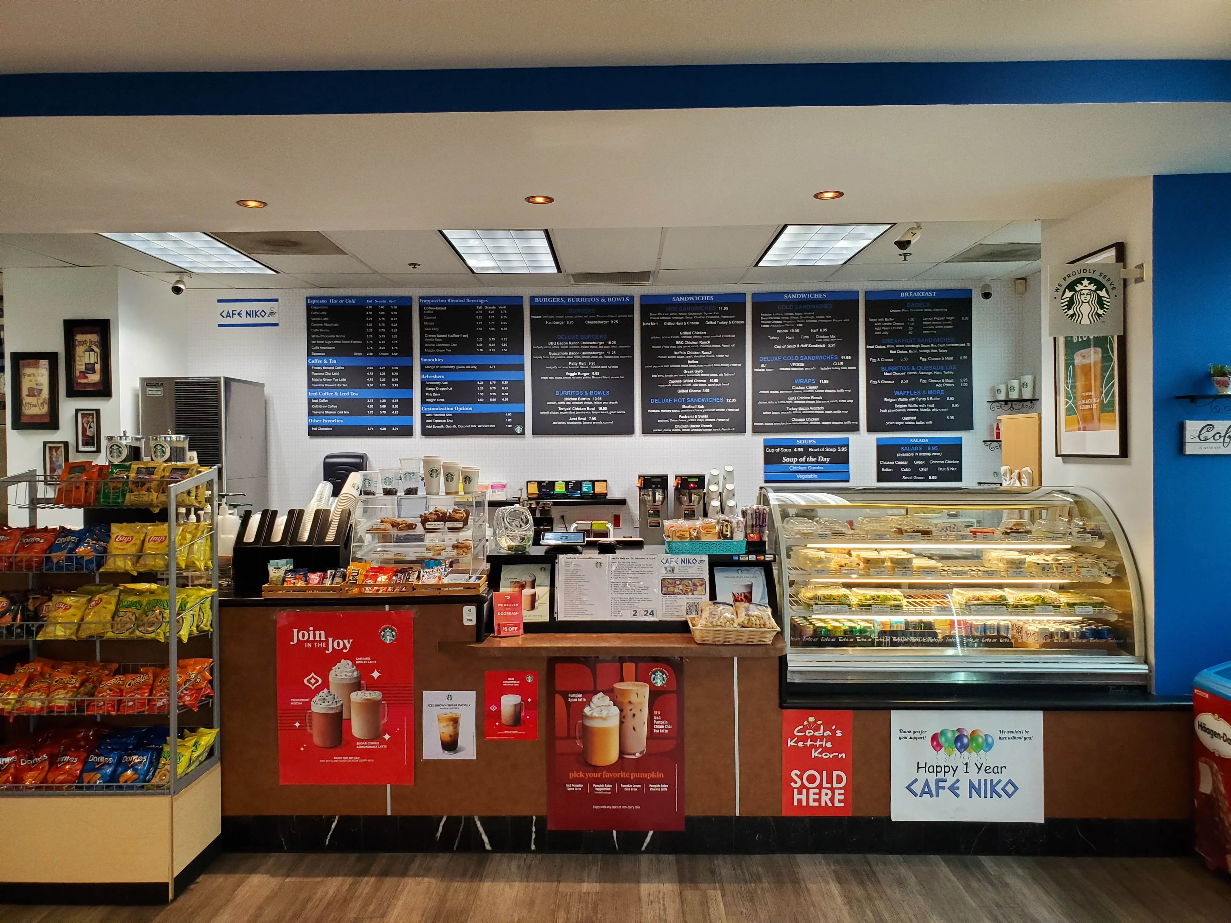 Cozy café interior with menu and display case