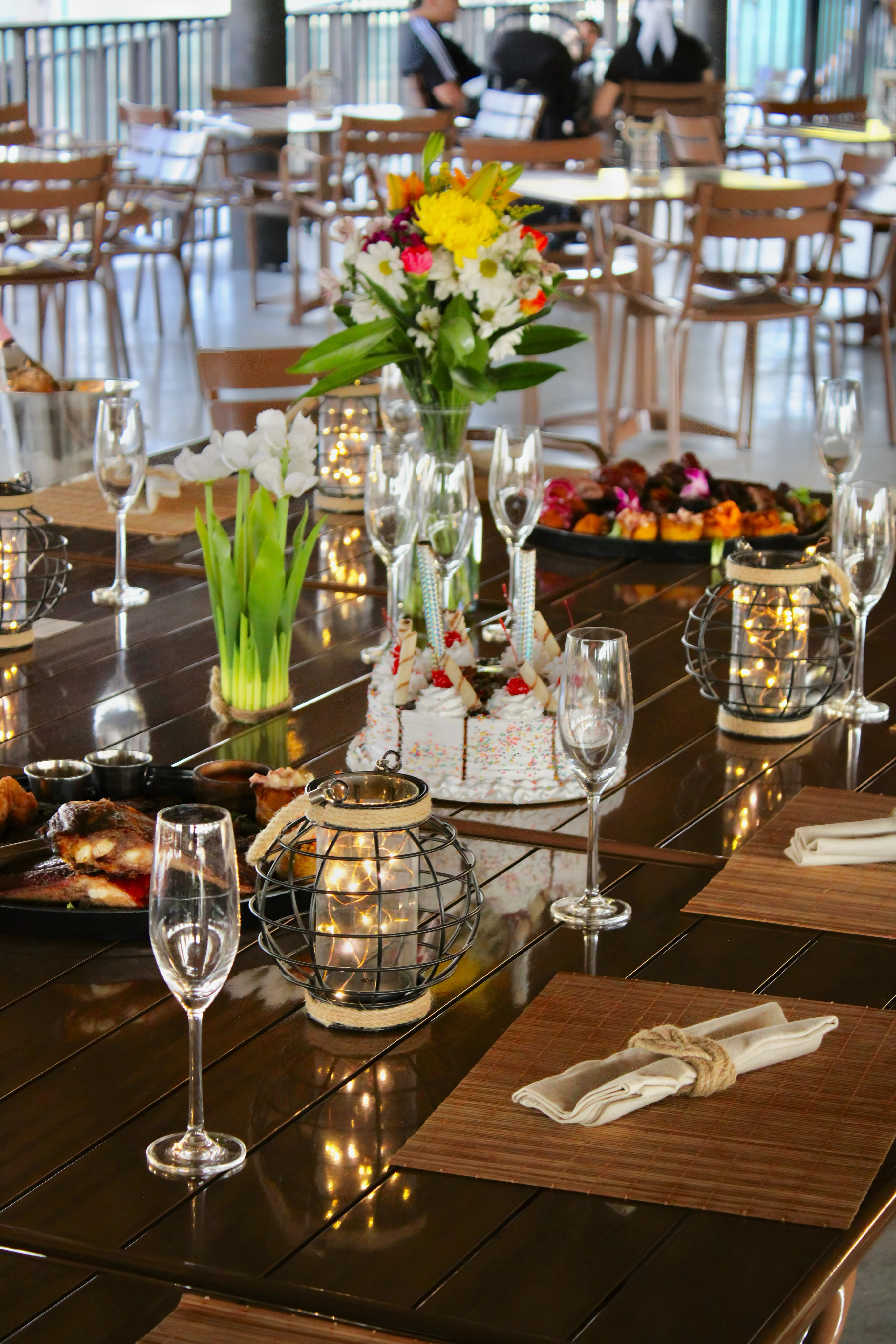 Elegant restaurant table setting with floral centerpiece and gourmet dishes
