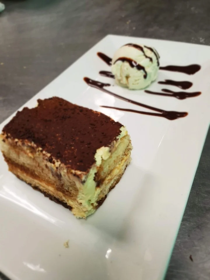 Classic Italian tiramisu with vanilla ice cream