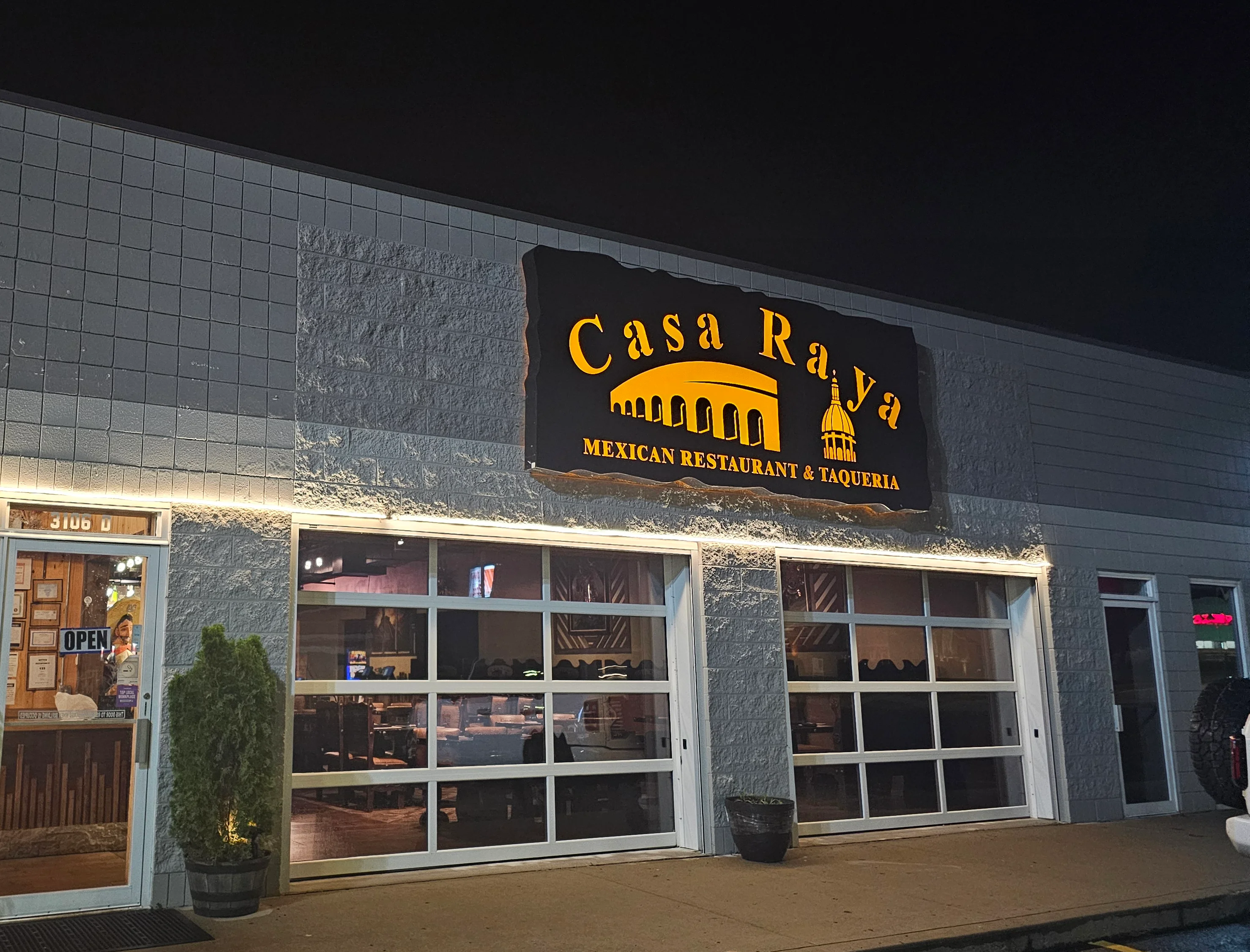 Exterior view of Casa Raya Mexican restaurant at night