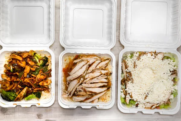A sizzling stir-fry featuring tender pieces of chicken, broccoli, and bell peppers, glistening with a rich sauce.