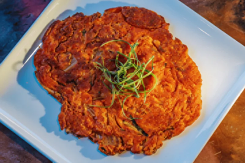 Korean savory pancake known as jeon with green onions