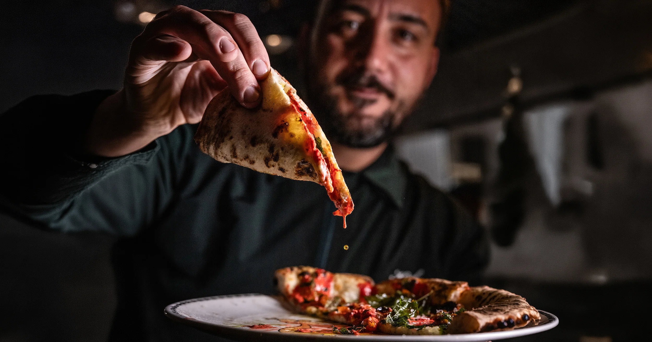Delicious pizza with fresh toppings on a wooden table