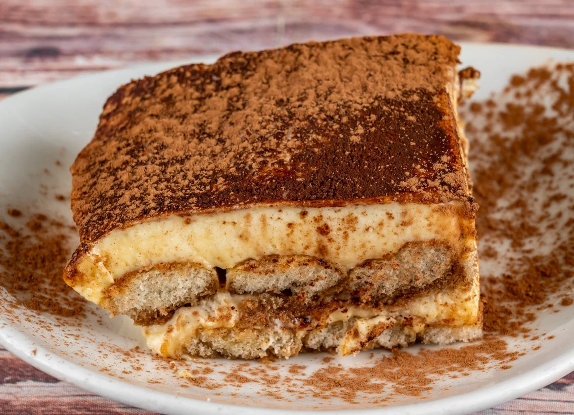 Delicious Italian tiramisu dessert dusted with cocoa powder